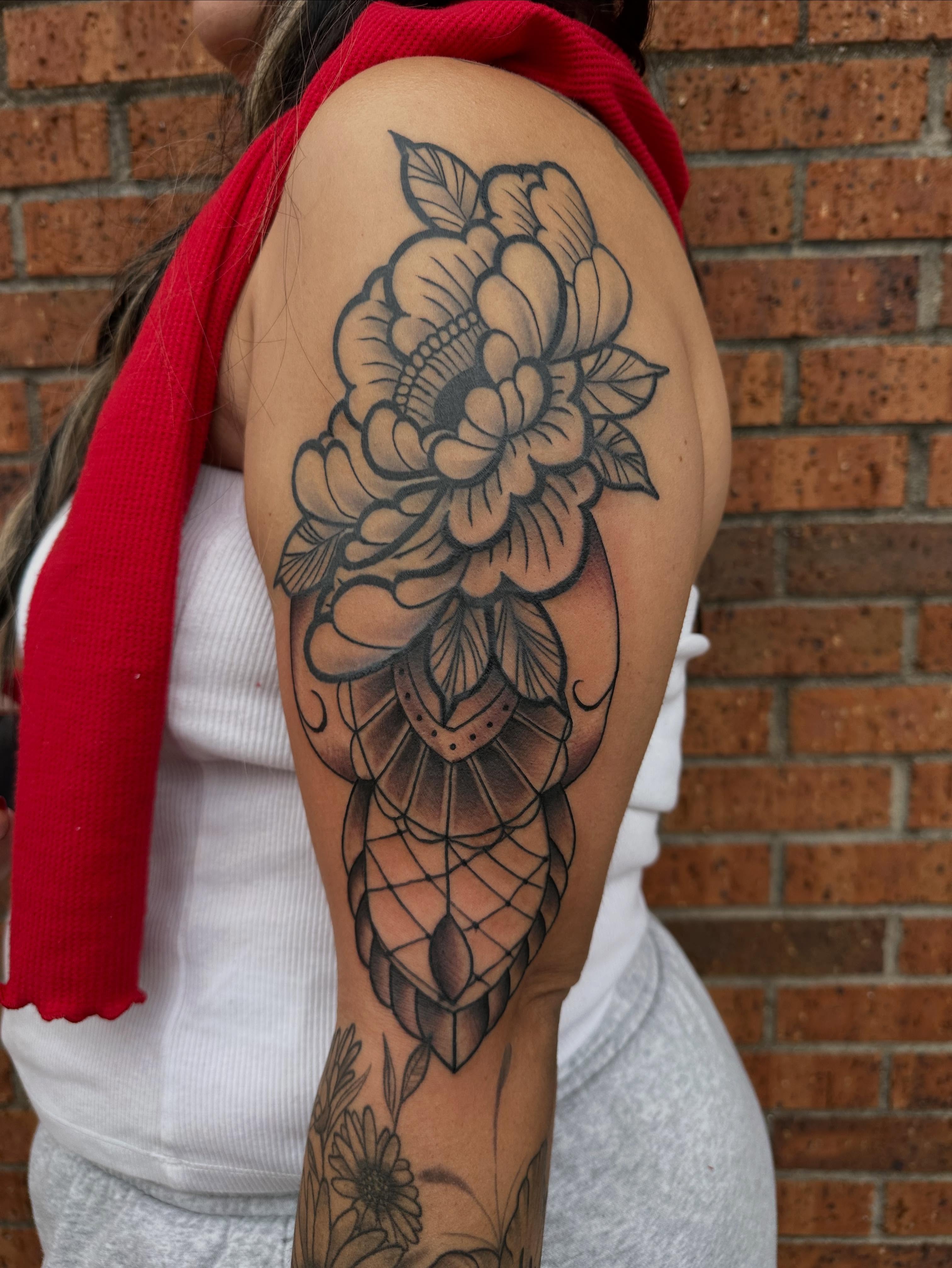 Floral bouquet American traditional tattoo on the shoulder by DFW