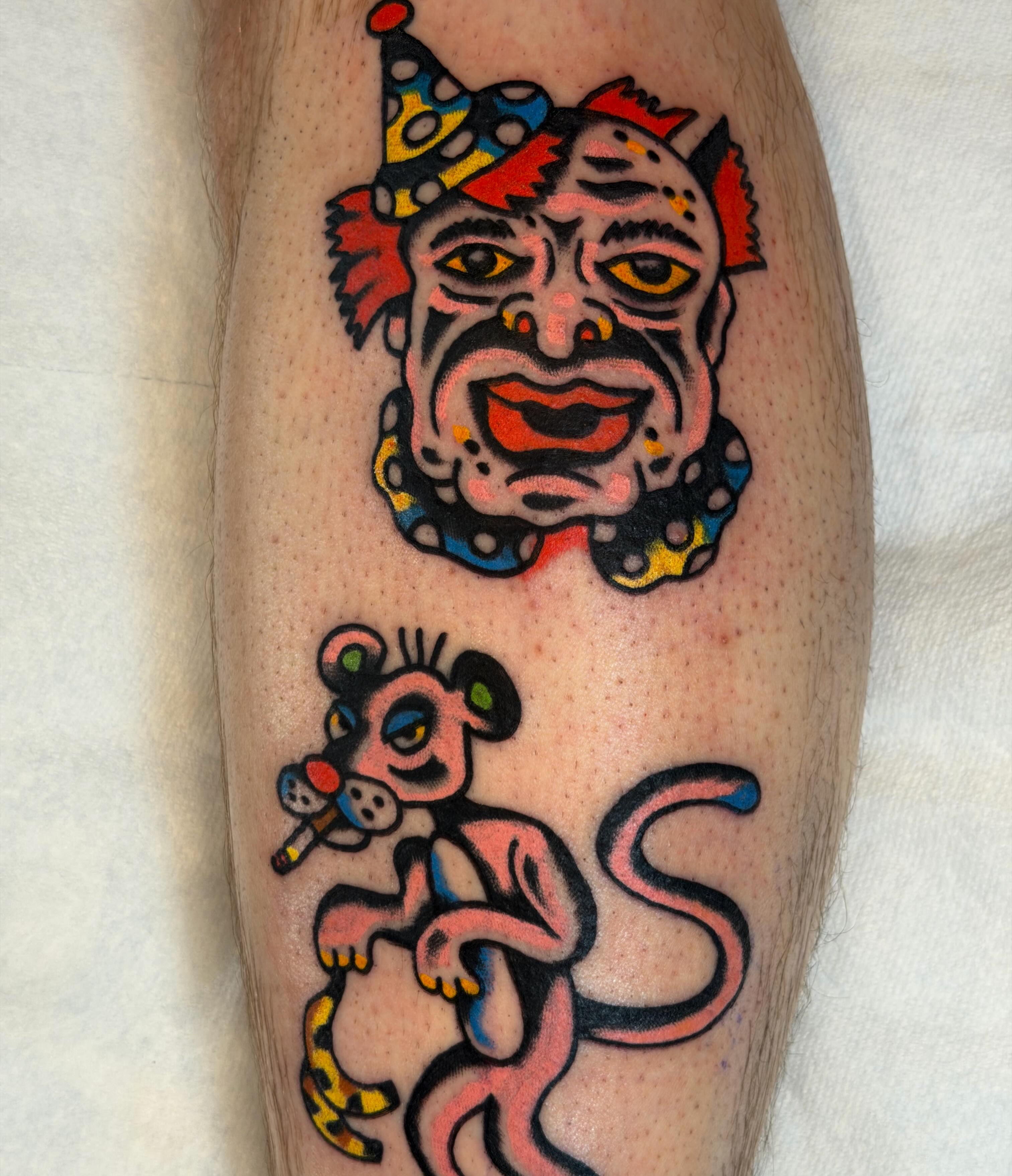 Clown and monkey American traditional tattoo on the forearm by Jake