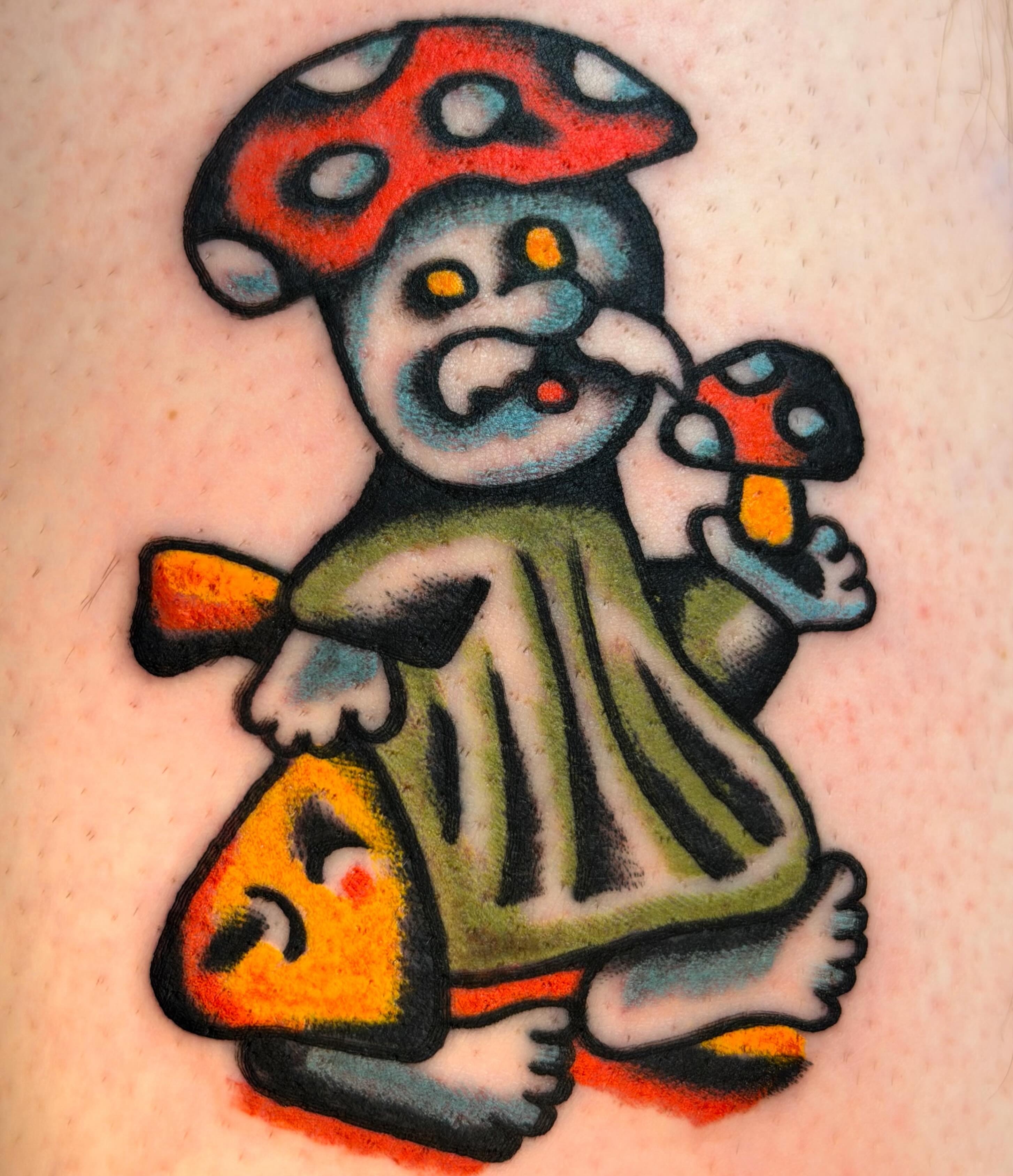 Mushroom character American traditional tattoo on the forearm by Jake