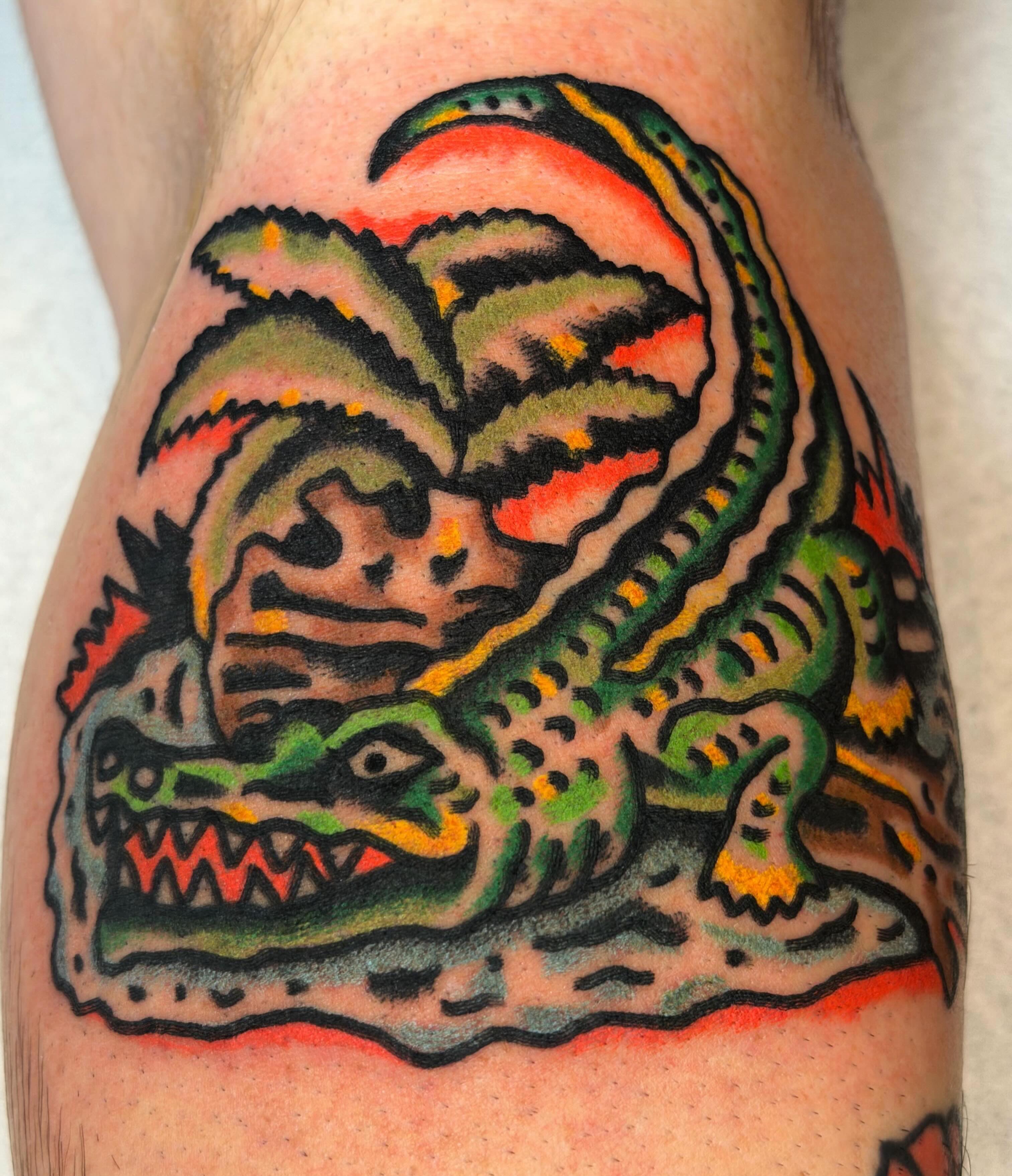 Alligator American traditional tattoo on the thigh by Jake