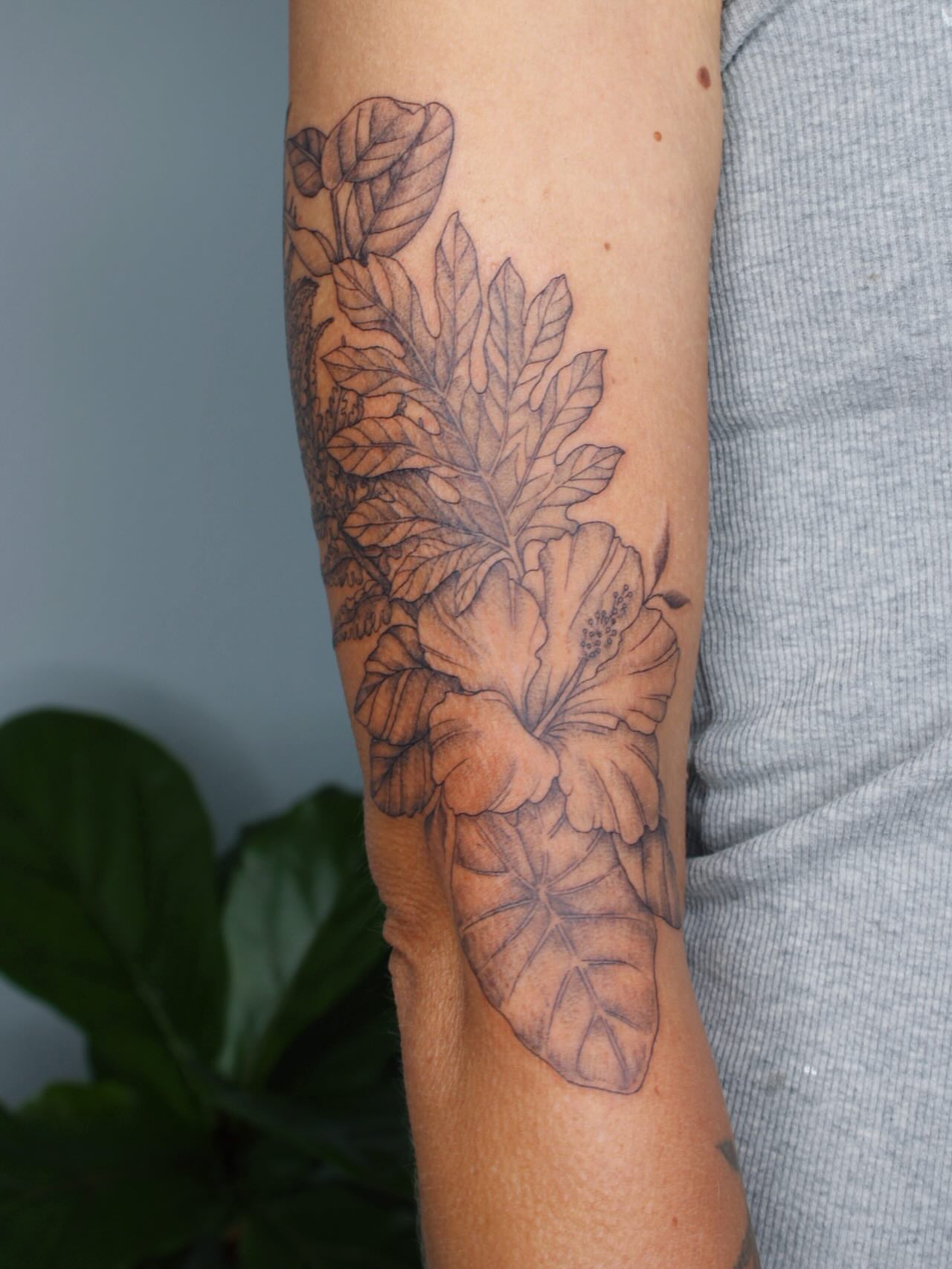 Floral arrangement realism tattoo on the forearm by Priscila - HAWAII TATTOO
