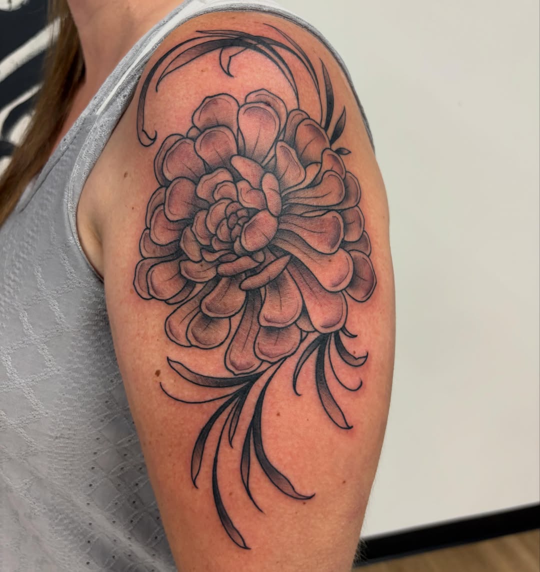 Flower black and grey tattoo on the upper arm by Kayla Fay, Baton Rouge, Louisiana