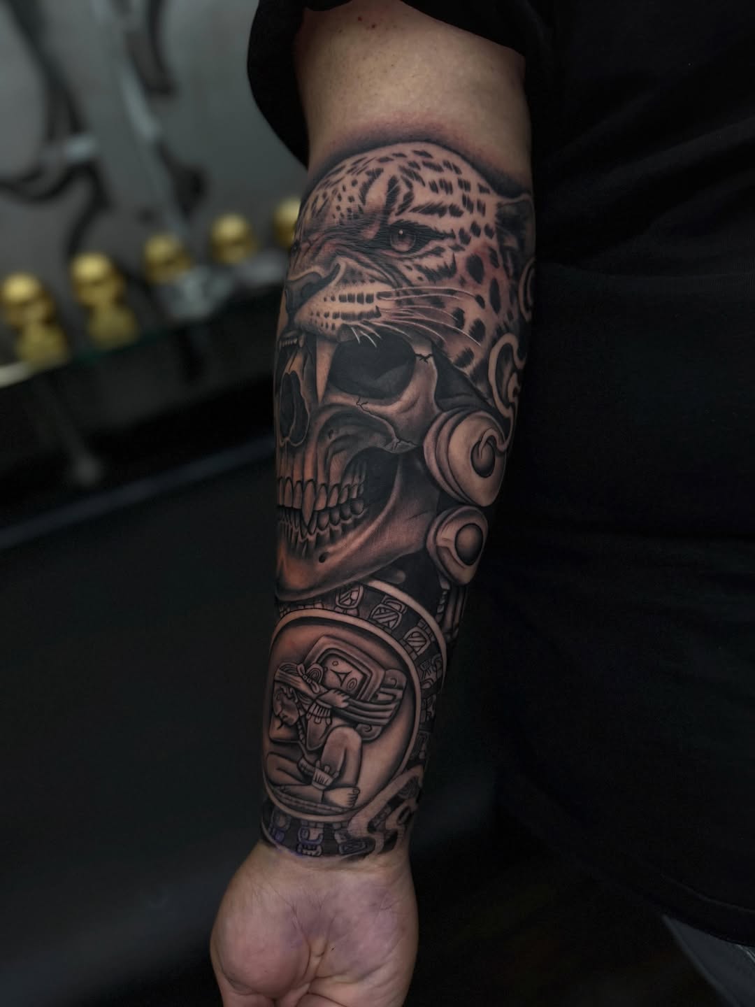 Jaguar and skull with aztec imagery realism tattoo on the forearm by LOS