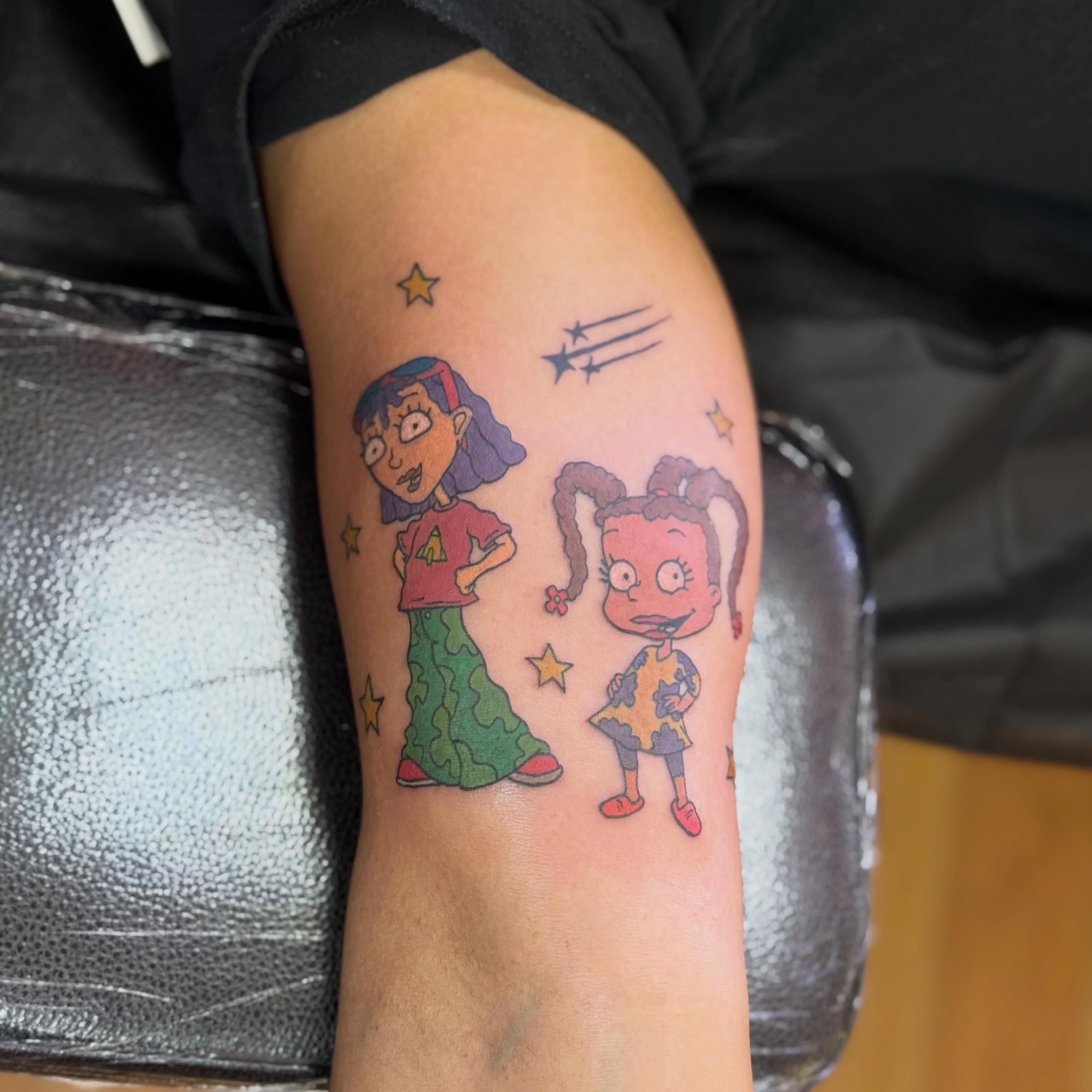 Daria and lisa illustrative tattoo on the forearm by Nic