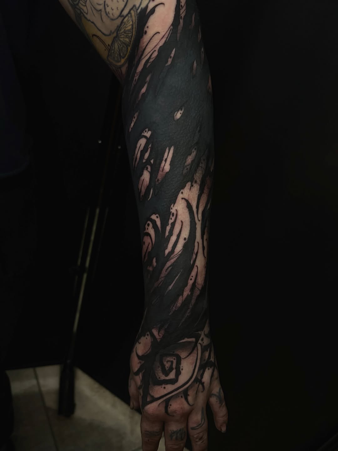 Abstract blackwork sleeve realism tattoo on the forearm by BodyArtByAlia