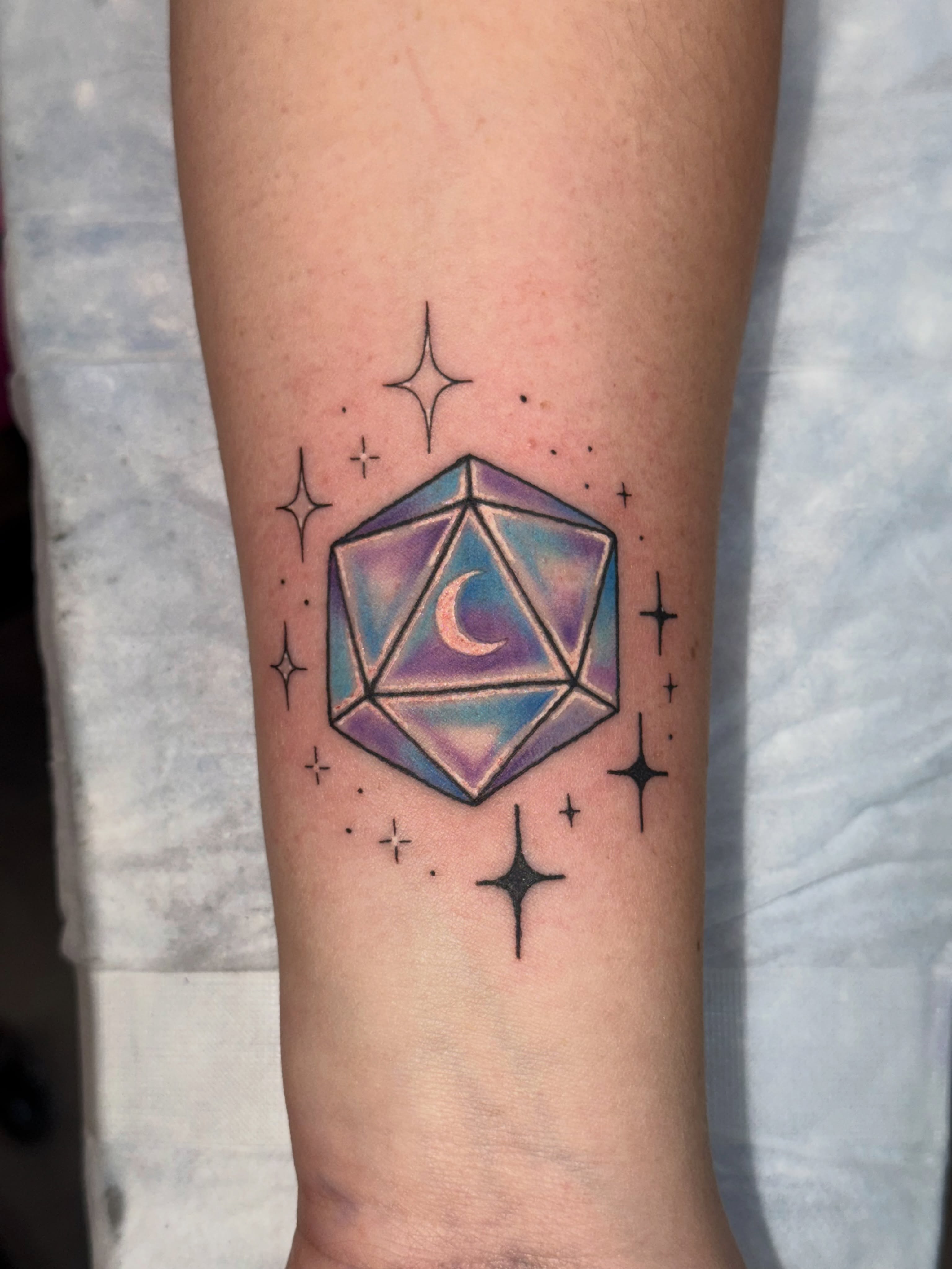 Geometric shape with crescent moon geometric tattoo on the forearm by Caitlynn Austin