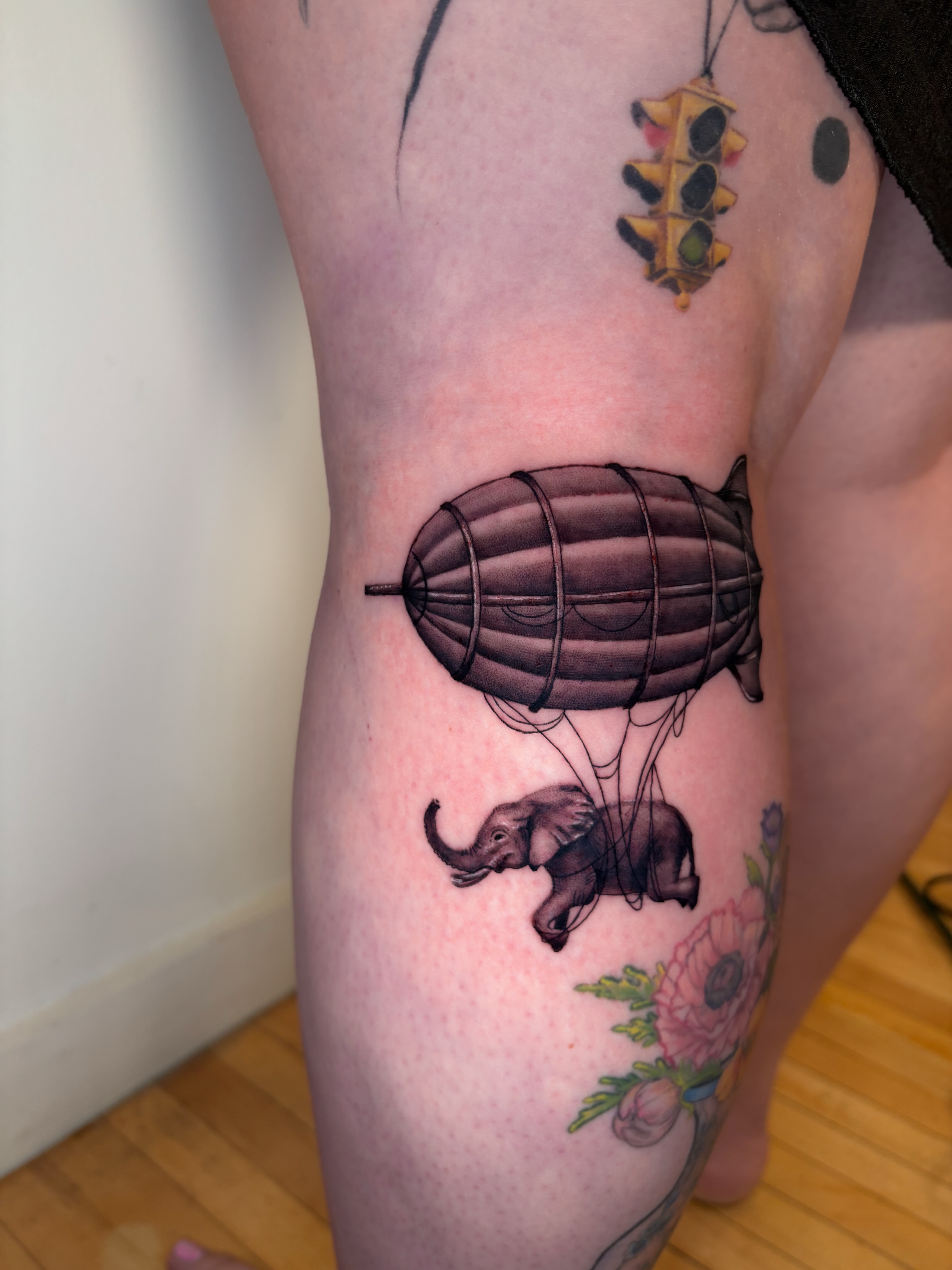 Airship with elephant realism tattoo on the thigh by Dani