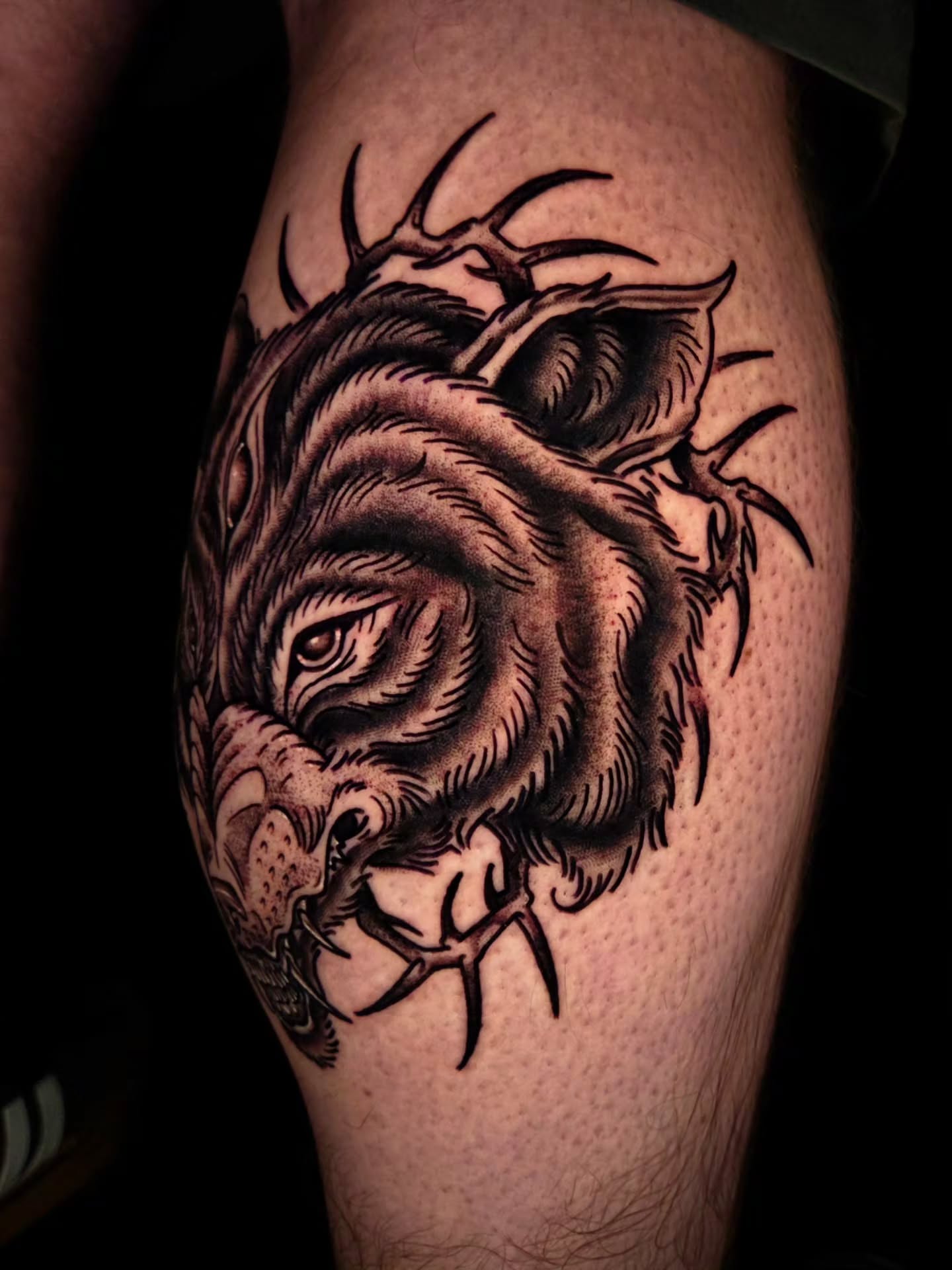 Bull black and grey tattoo on the thigh by Ian Kiser