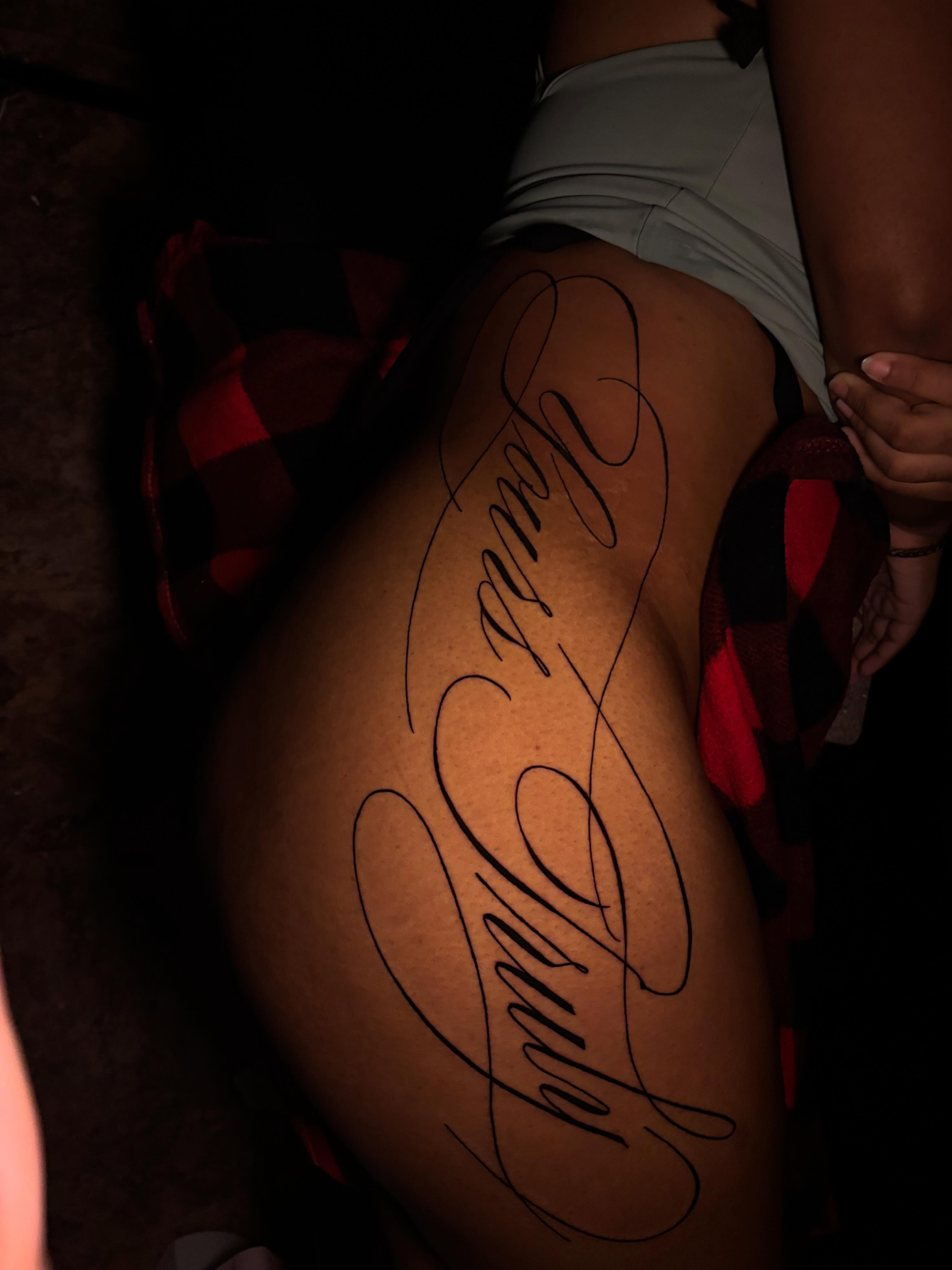 Script lettering lettering script tattoo on the thigh by Inkys Tatts