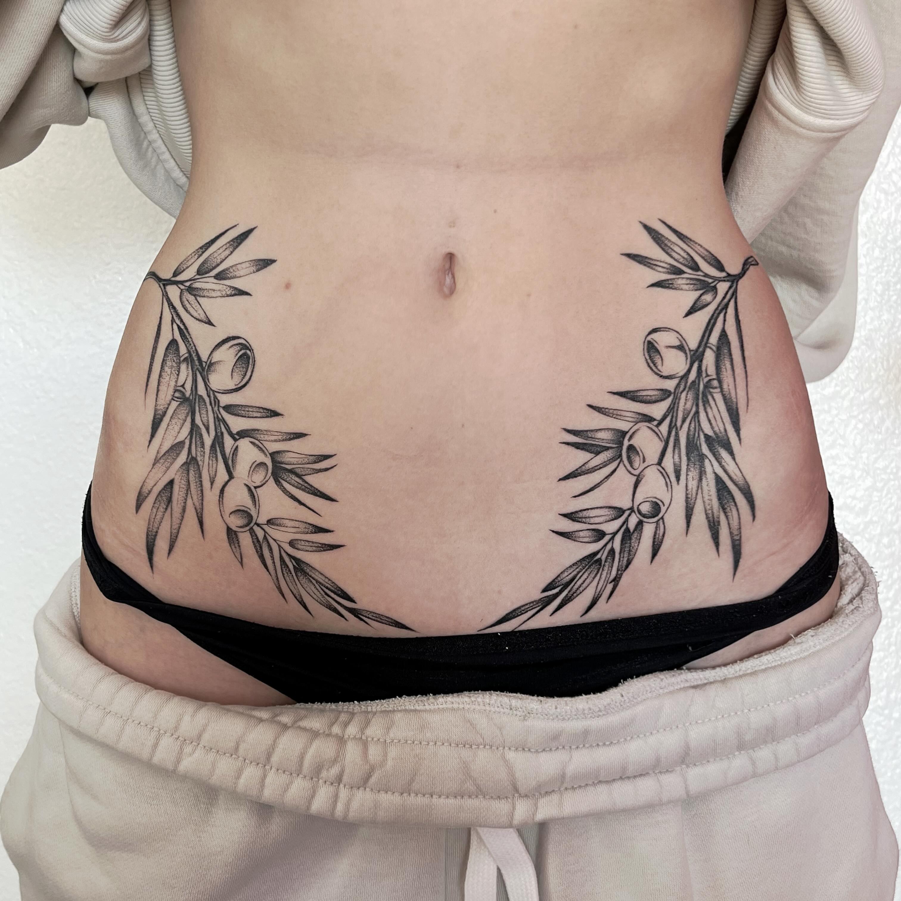Olive branch dotwork tattoo on the torso by Sara Atamian, San Diego, California