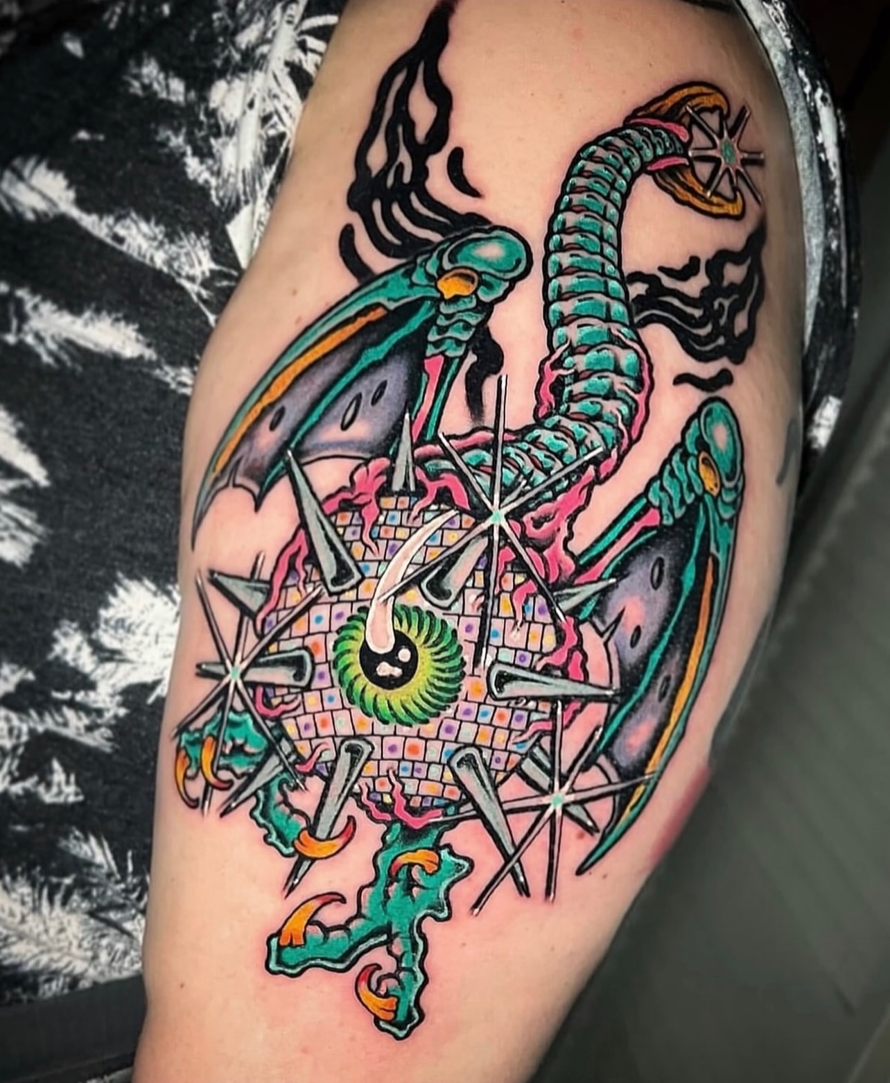 Alien and compass new school tattoo on the thigh by Jade Napier