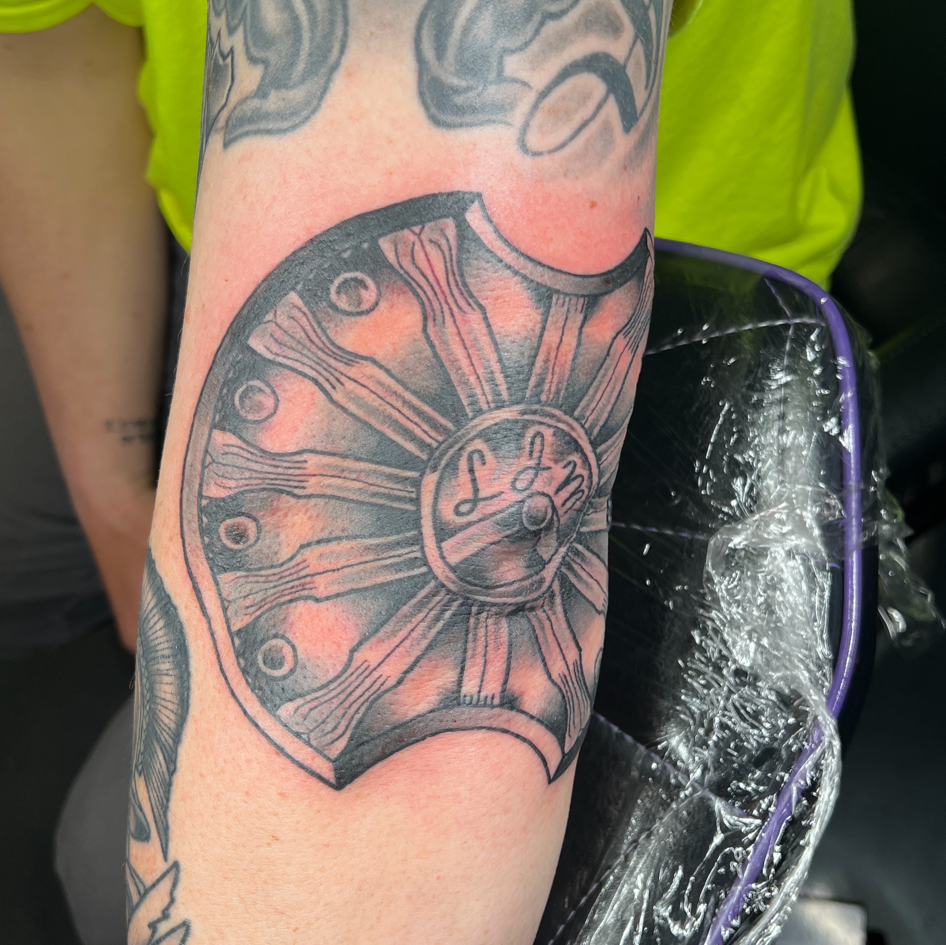 Medieval shield black and grey tattoo on the forearm by Brian Mock