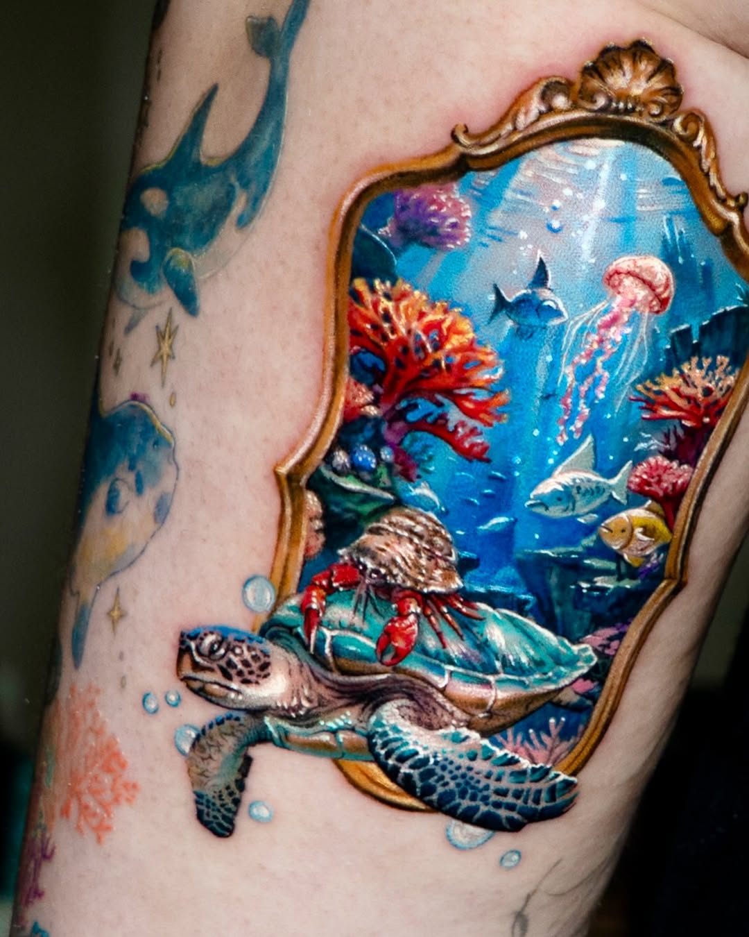 Underwater scene with turtle and crab watercolor tattoo on the forearm by Tattooist HARRY COLOR