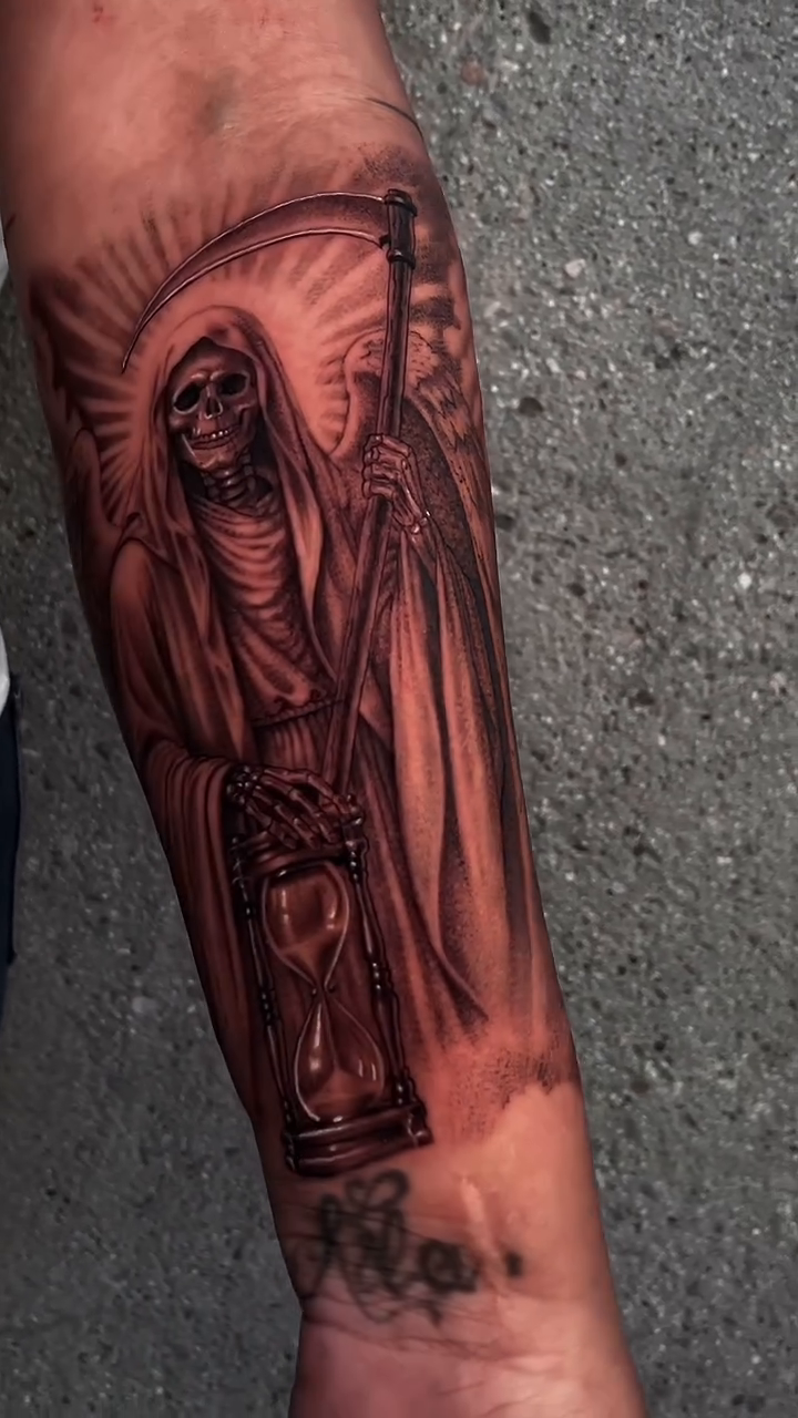 Grim reaper with hourglass realism tattoo on the forearm by Chato
