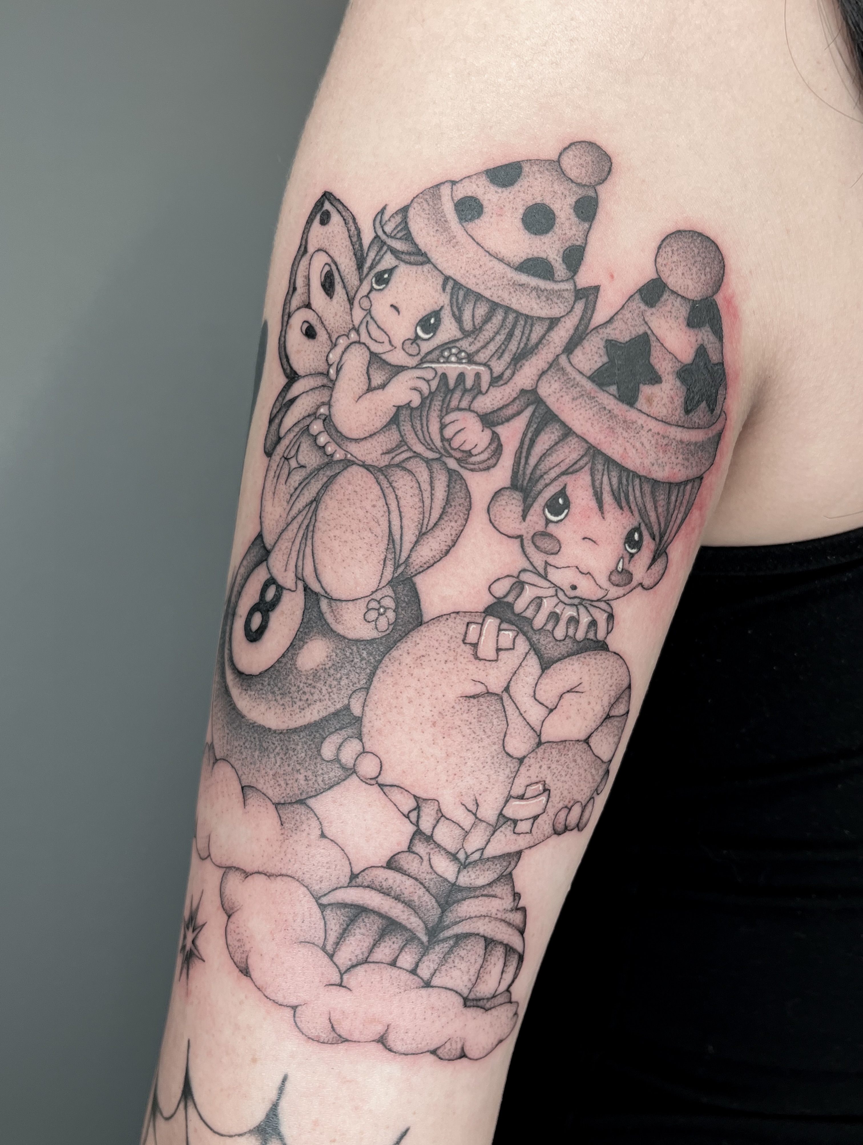Clowns and butterfly dotwork tattoo on the forearm by The One Who’s Always Drawing