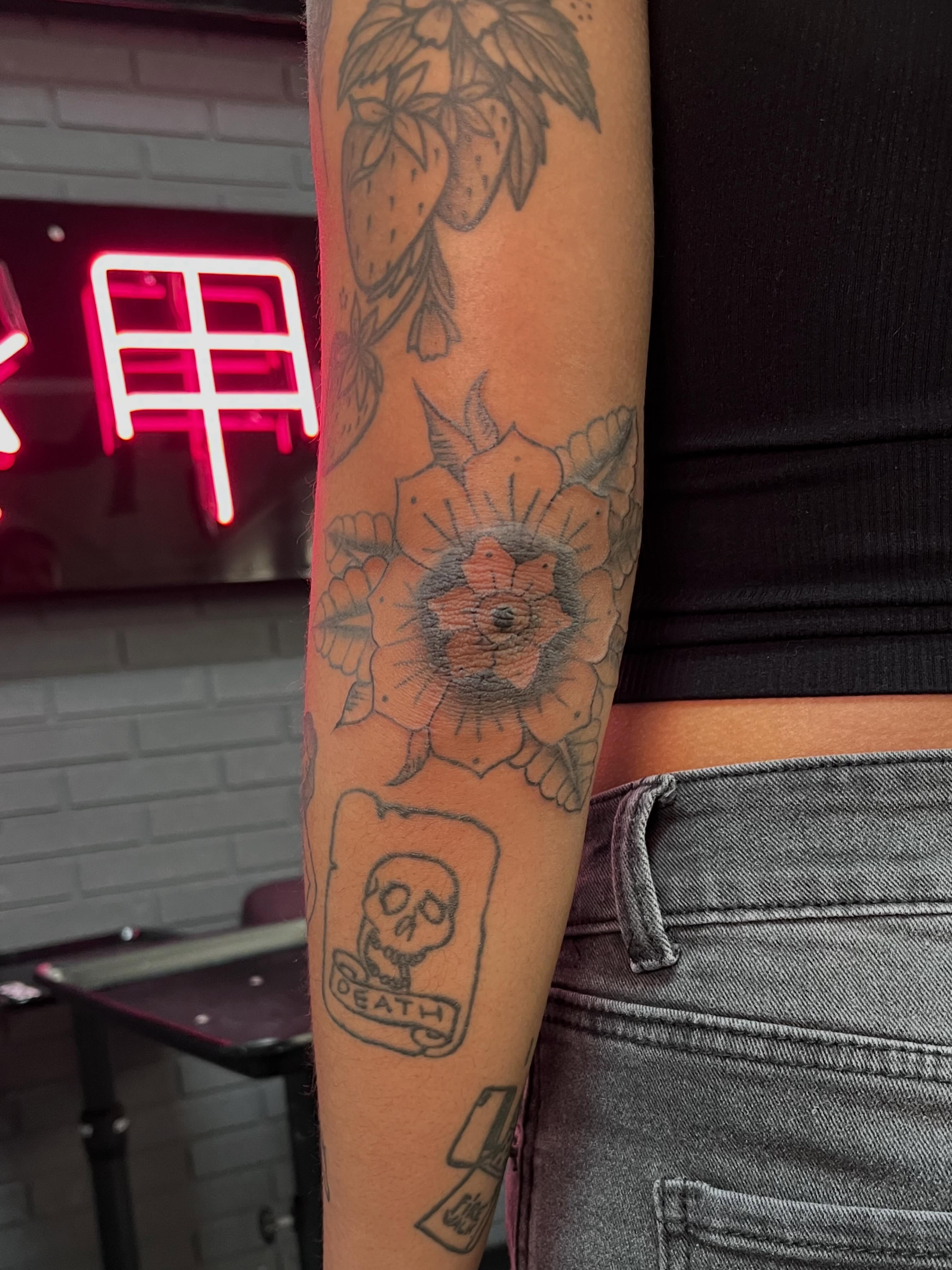 Flower and skull black and grey tattoo on the forearm by Bunny 🐰