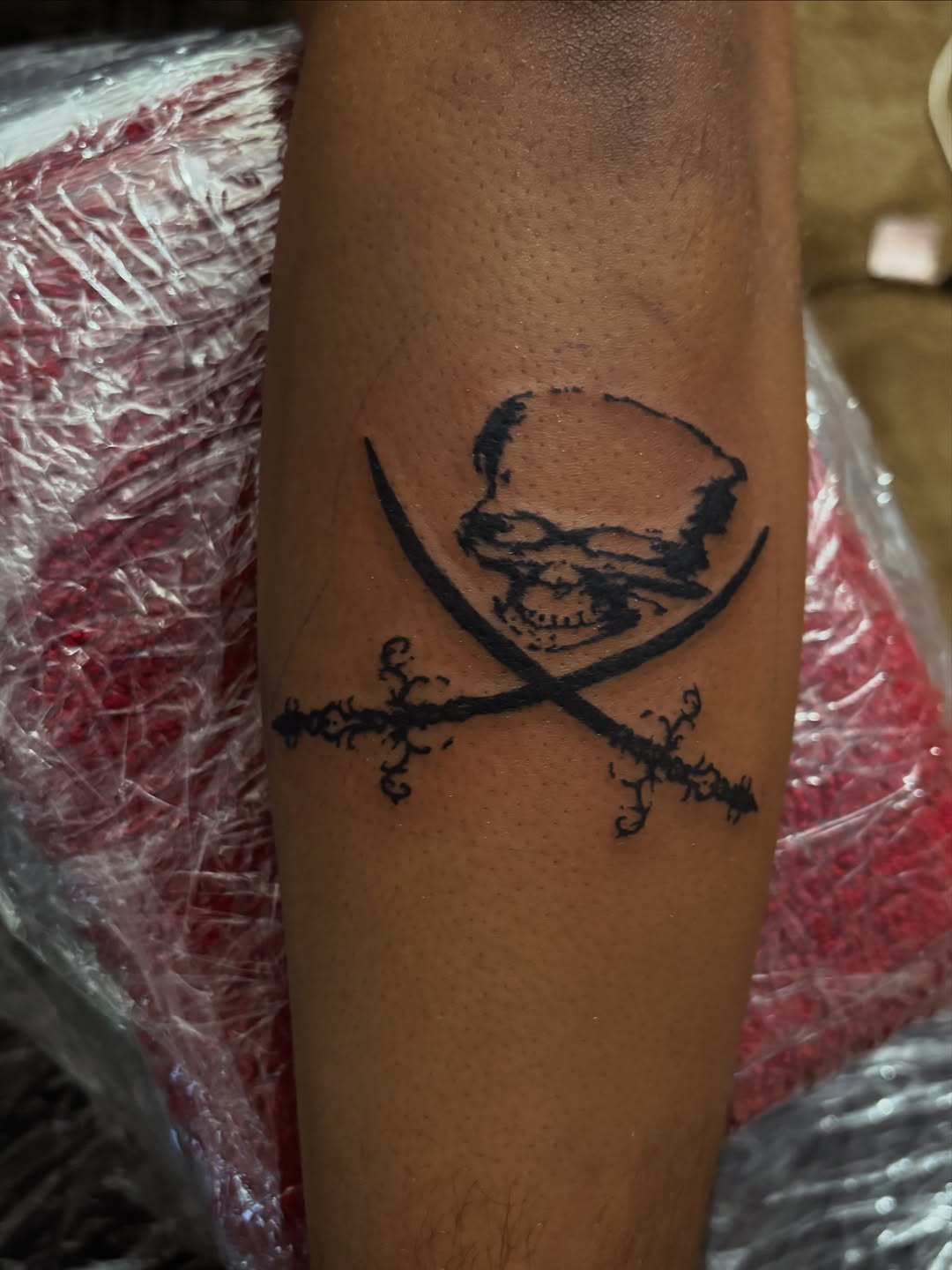 Skull and crossed swords tattoo on the forearm by winrytattoome