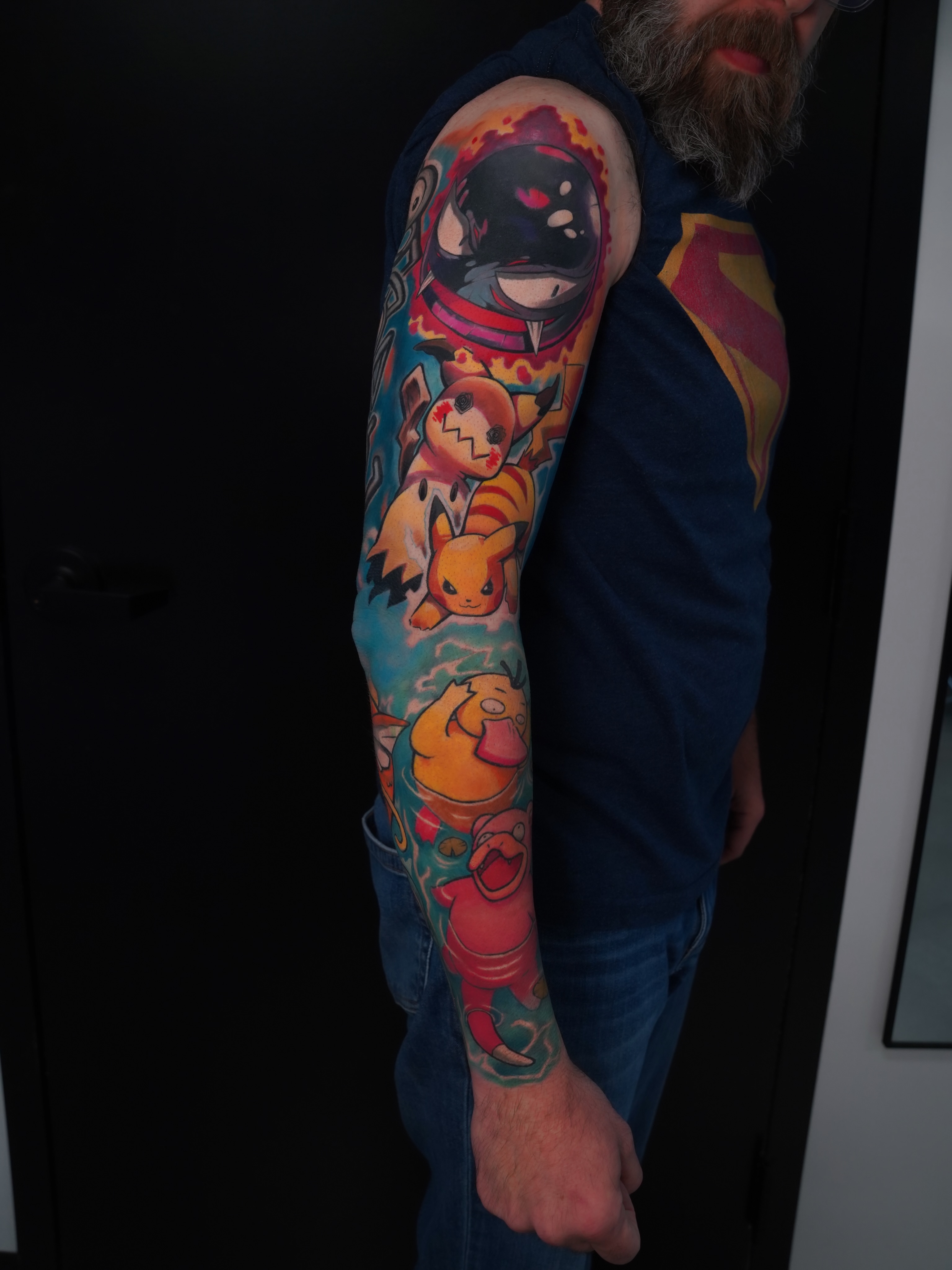 Pokemon characters new school tattoo on the upper arm by Derek Foferek, Charlotte, North Carolina