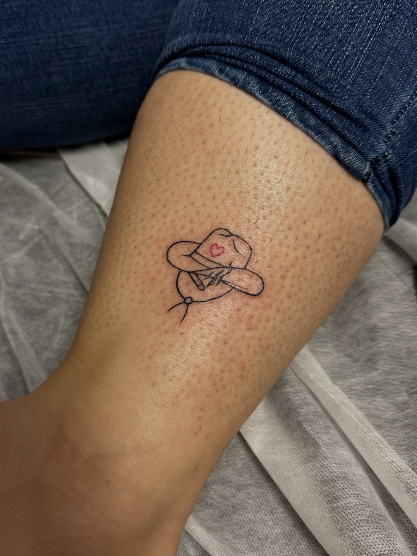 Cowboy hat fine line tattoo on the forearm by Jocelyn