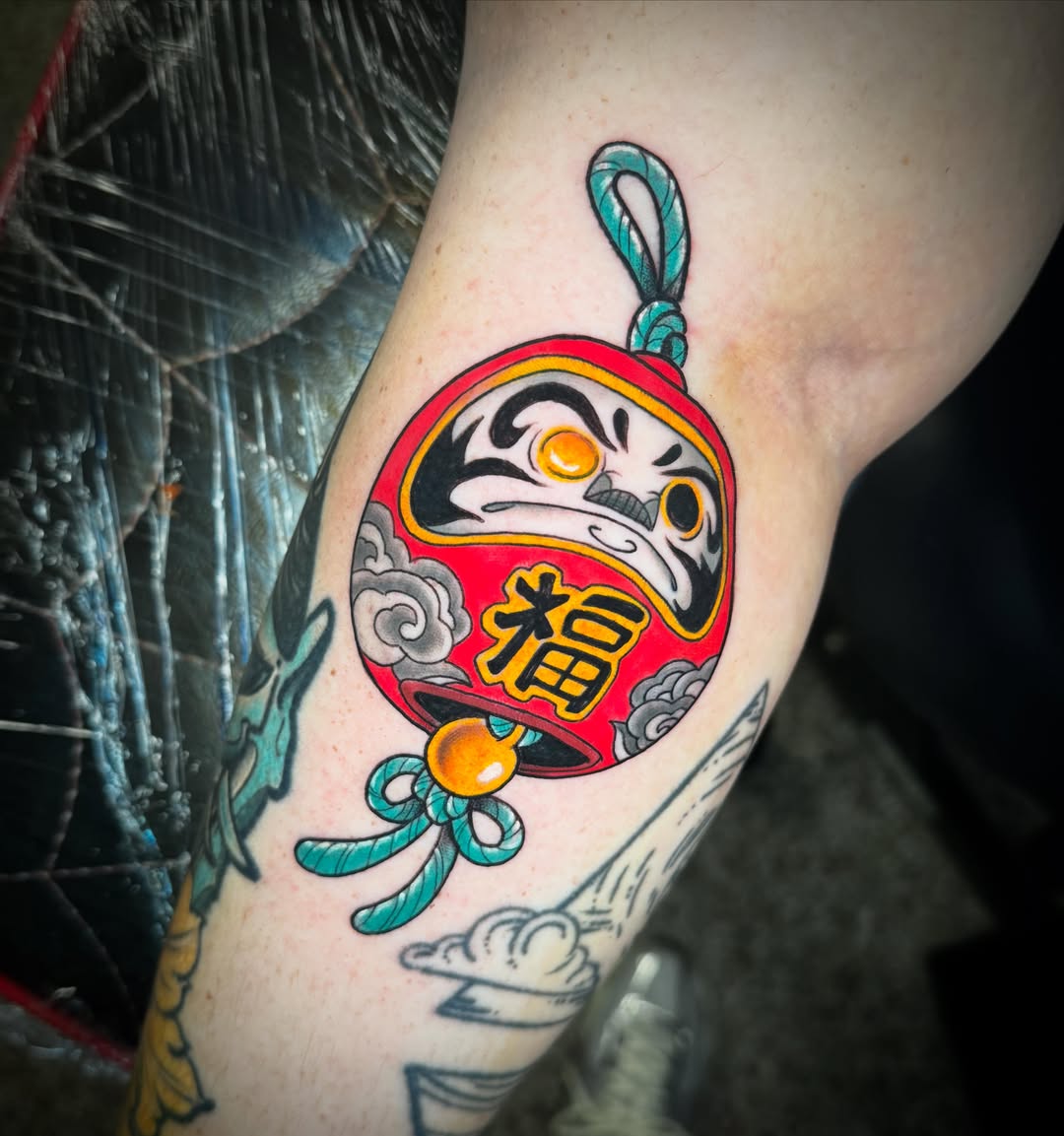 Daruma doll American traditional tattoo on the forearm by Graham Edward Vogel