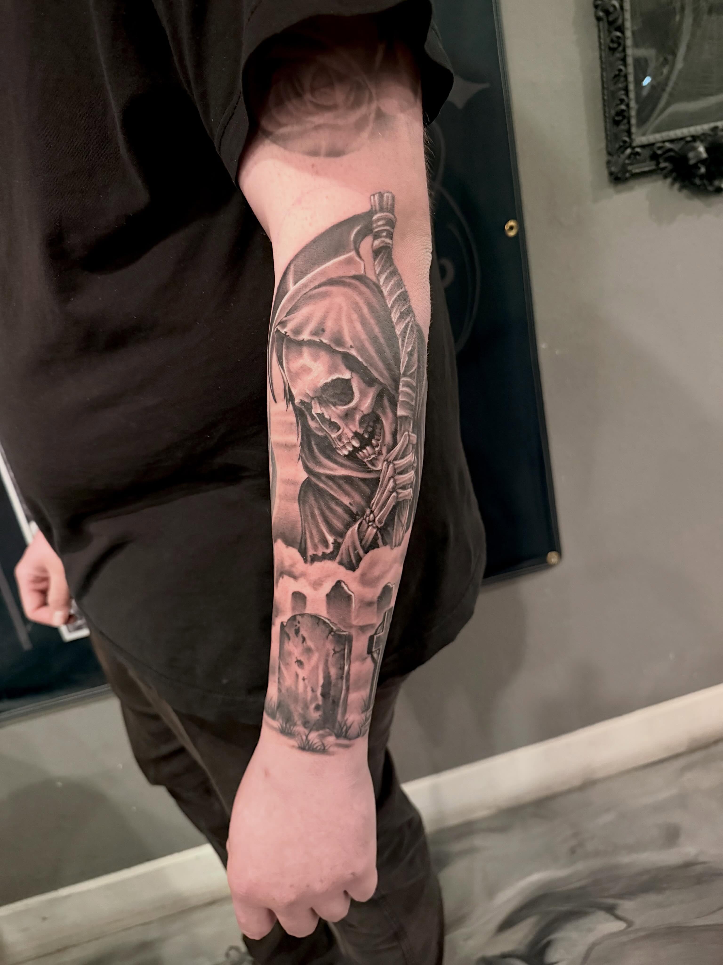 Grim reaper realism tattoo on the forearm by Cody Pappas