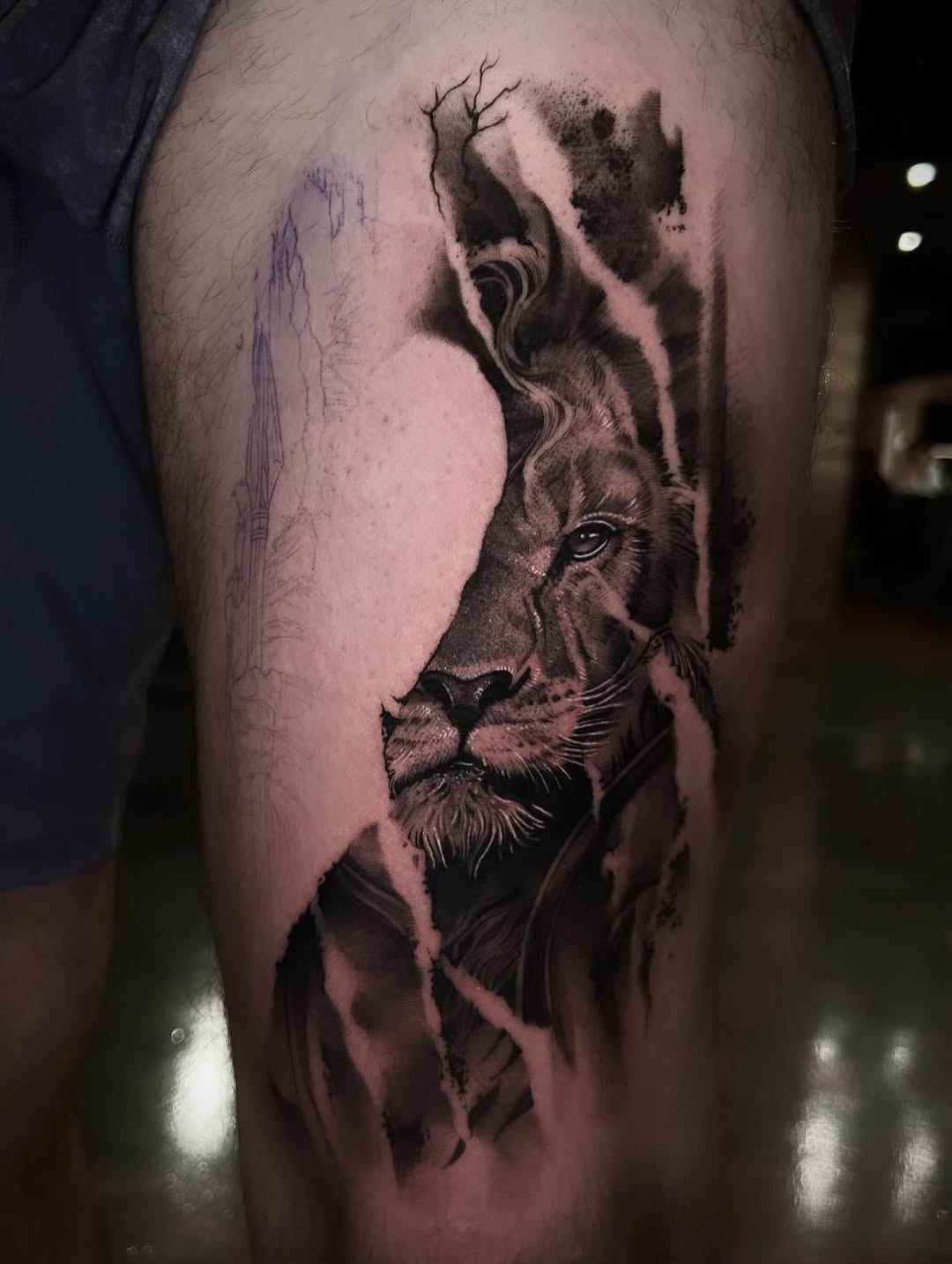 Lion portrait realism tattoo on the thigh by Dallas Corsmeier