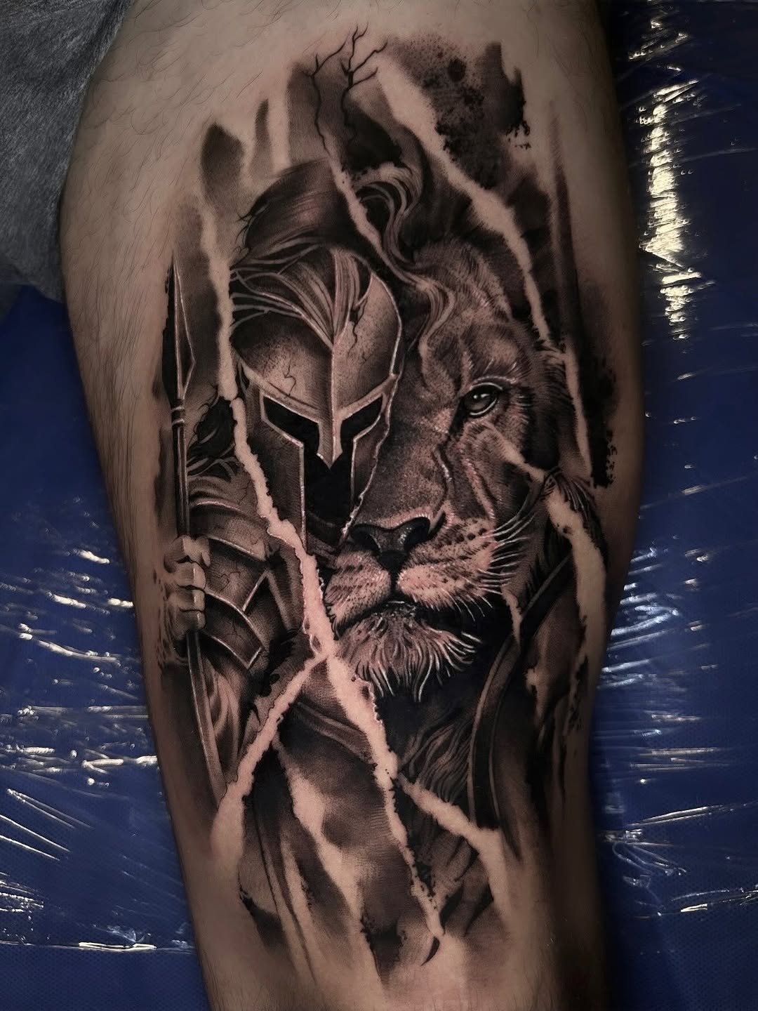 Spartan warrior and lion realism tattoo on the thigh by Dallas Corsmeier