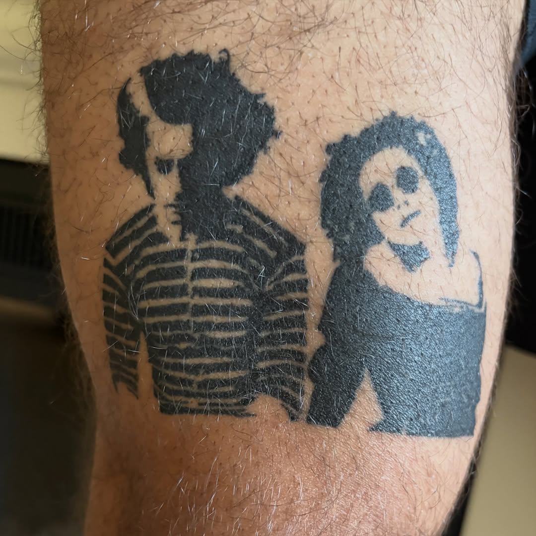 Beetlejuice and Lydia Deetz tattoo on the forearm by winrytattoome