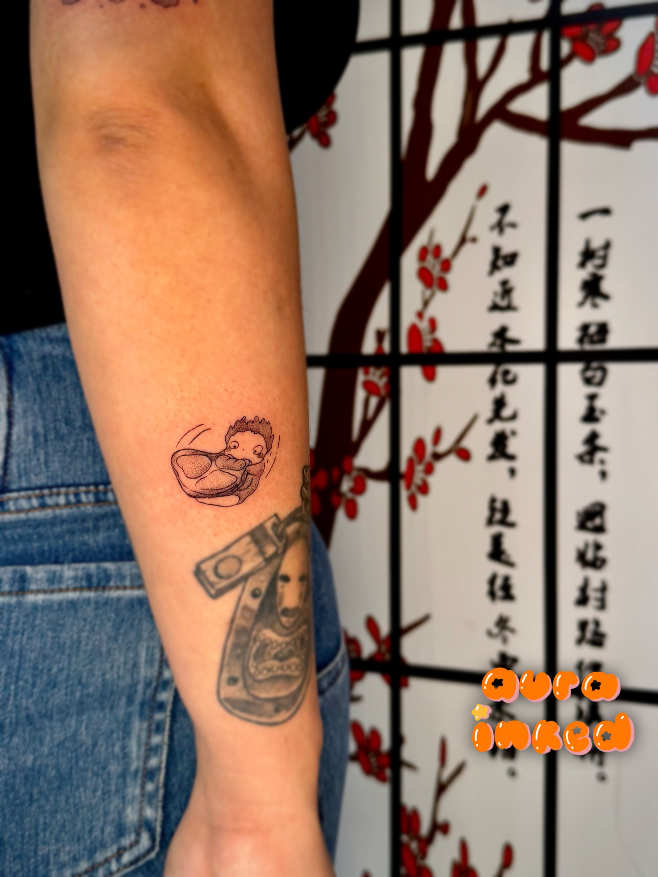 Baby in diaper American traditional tattoo on the forearm by Delly ⌯