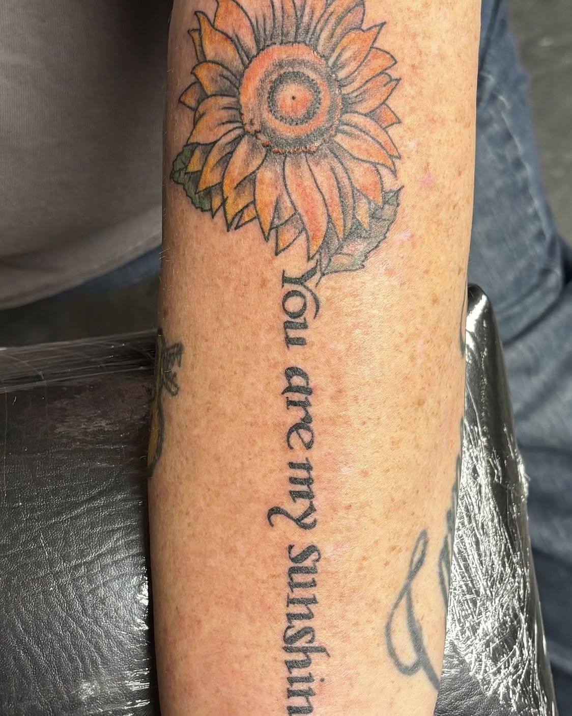 Sunflower dotwork tattoo on the forearm by Jeff Zuptich