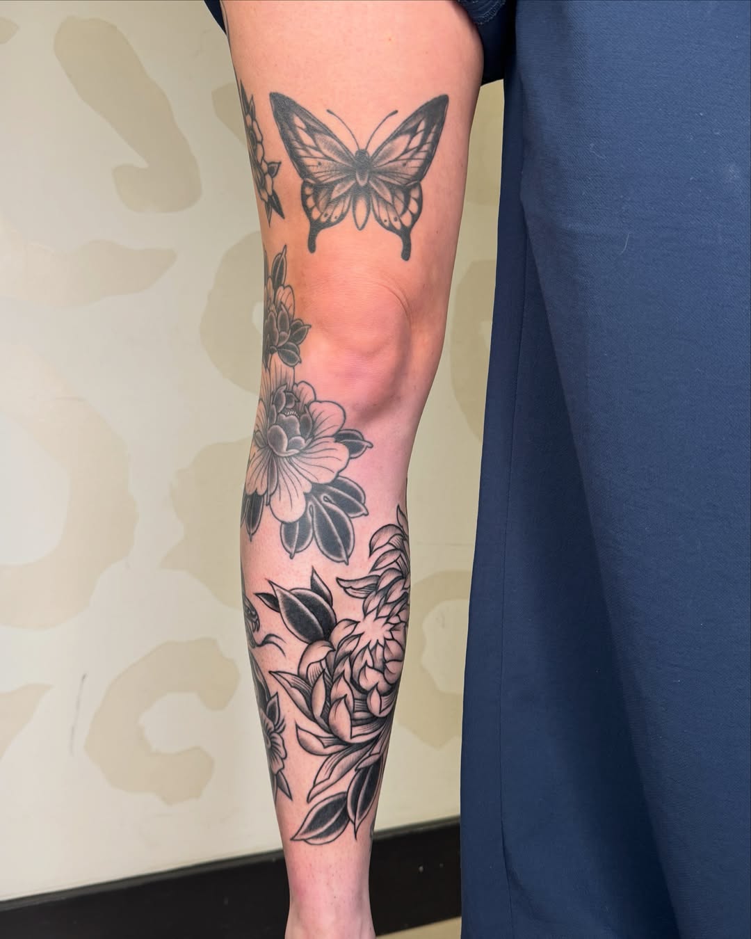 Butterfly and floral black and grey tattoo on the forearm by Bre Grover, Vancouver, British Columbia