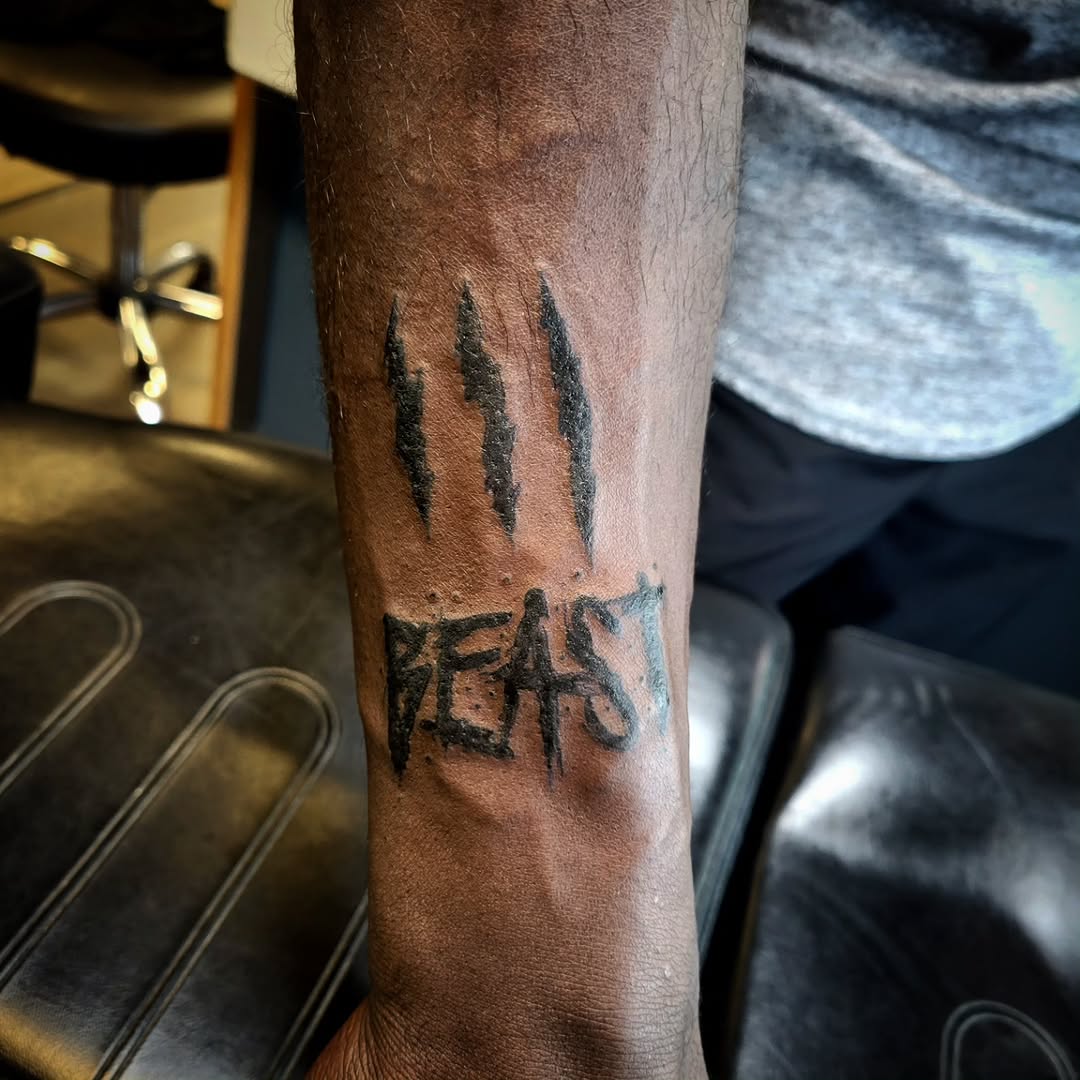 Tattoo by @cryingwoof — lettering_script, blackwork