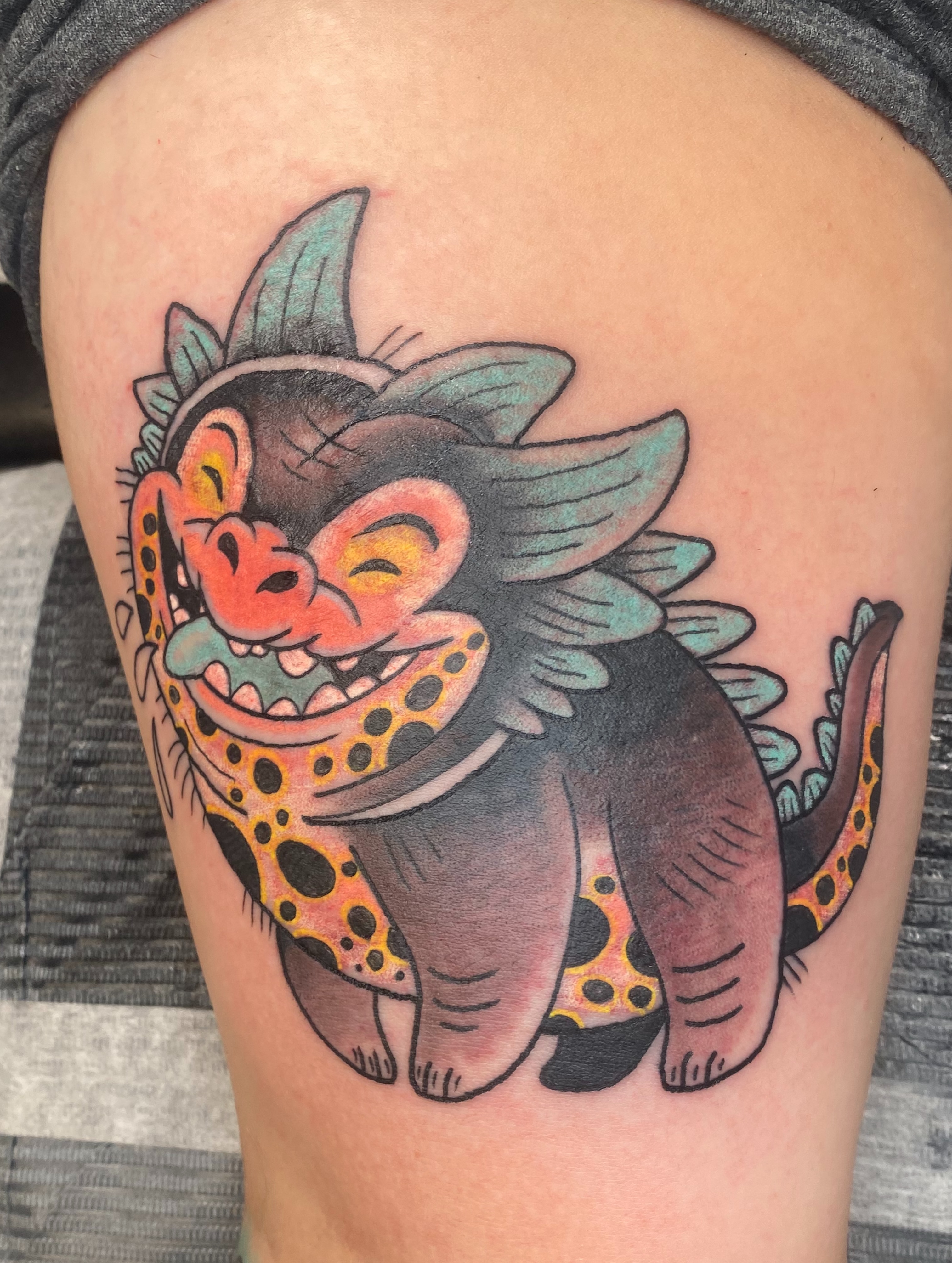 Monkey American traditional tattoo on the thigh by Aidan Monahan Tattoo