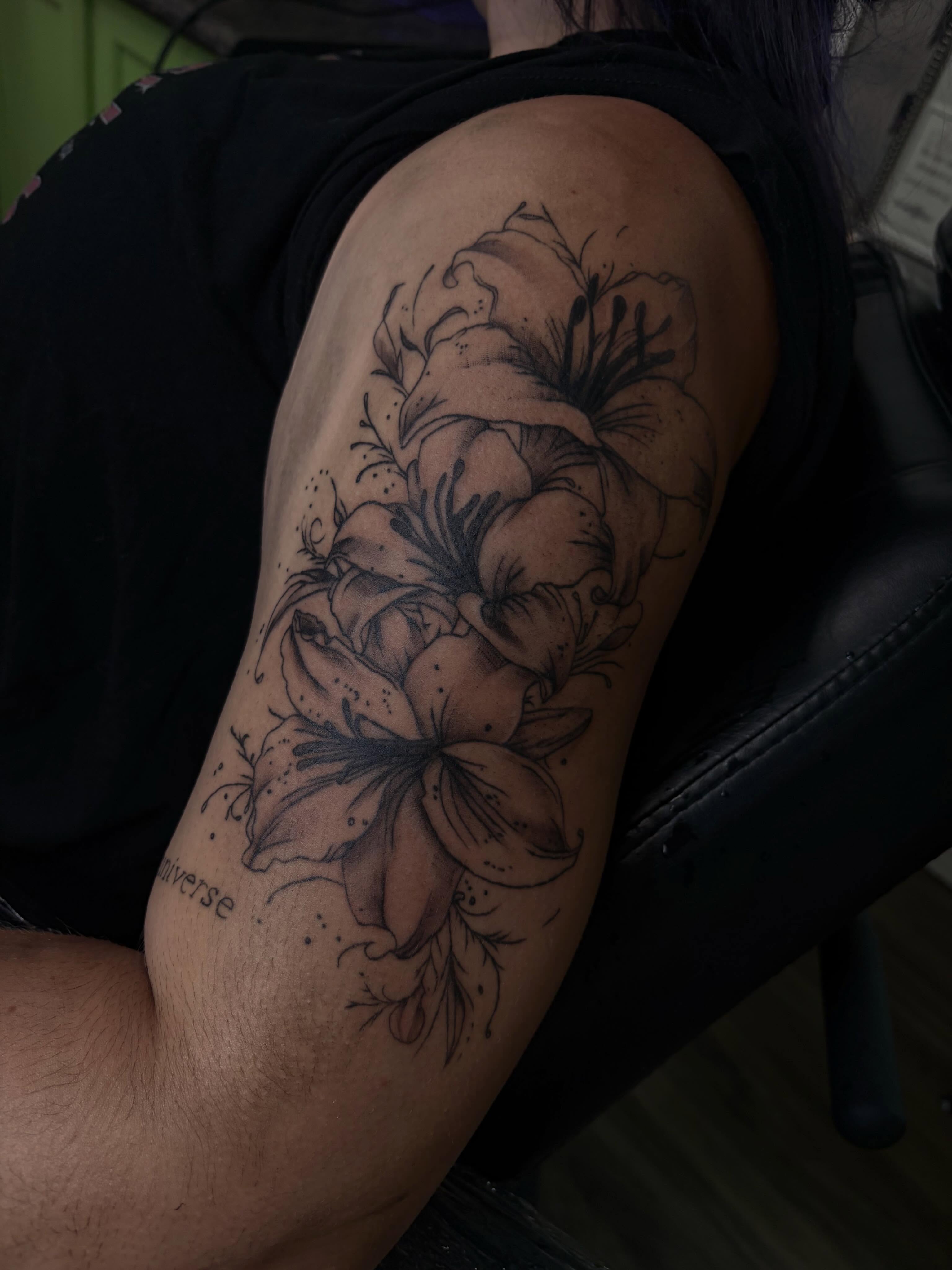 Lilies dotwork tattoo on the shoulder by Cincinnati Tattoo Artist