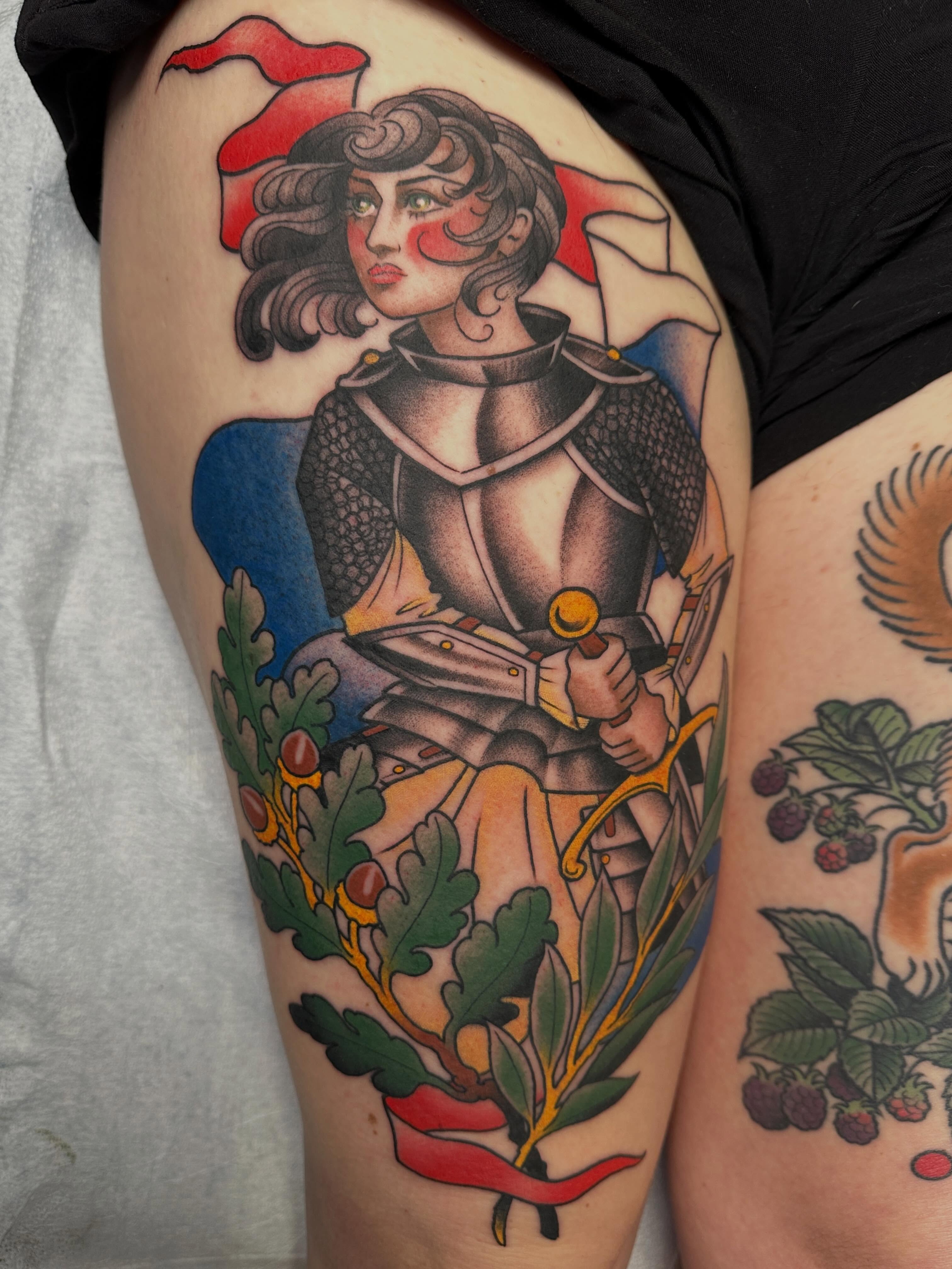 Knight with laurel wreath American traditional tattoo on the thigh by Megon Shore, Seattle, Washington
