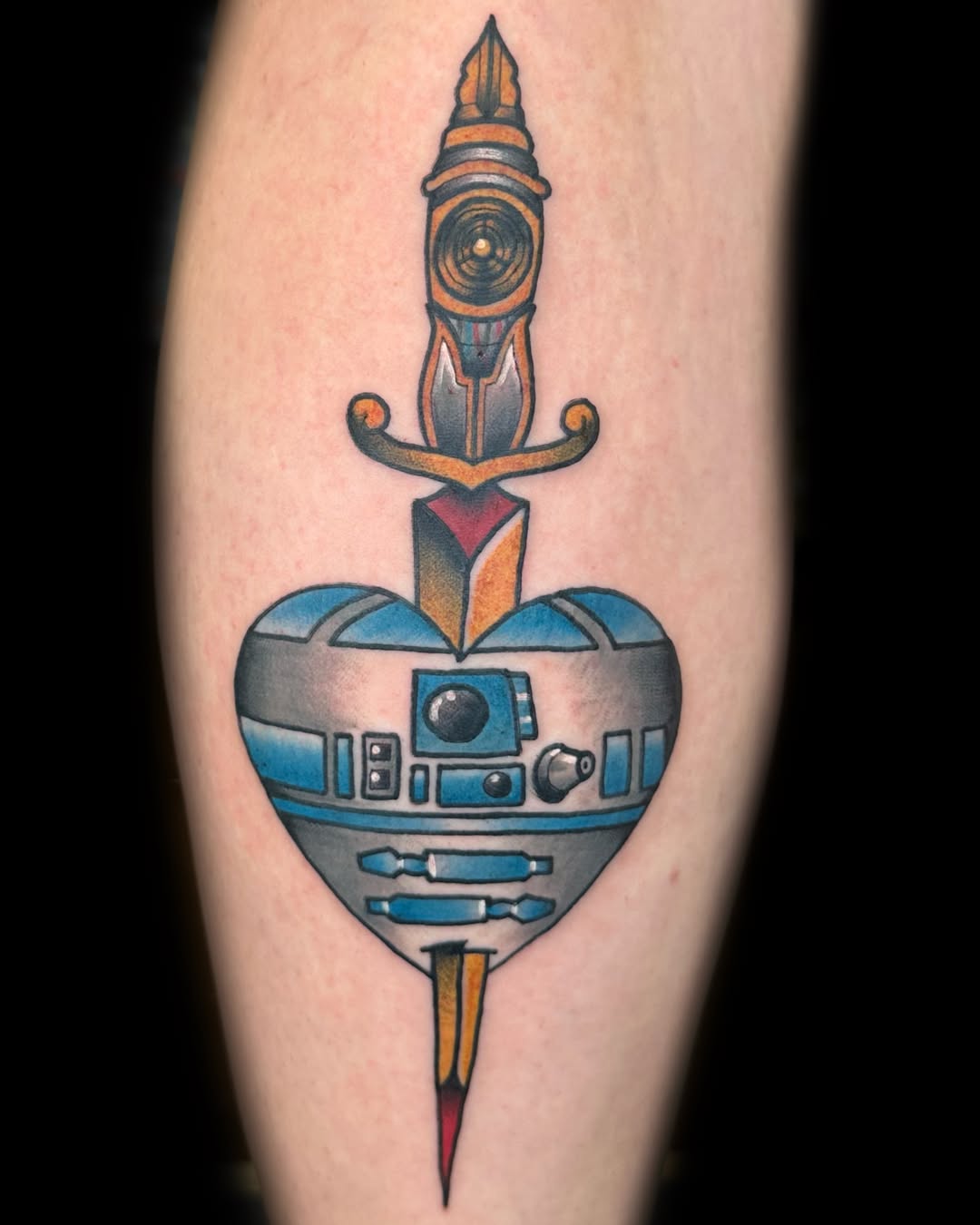 R2-D2 heart with dagger American traditional tattoo on the forearm by Nick Bones, Las Vegas, Nevada