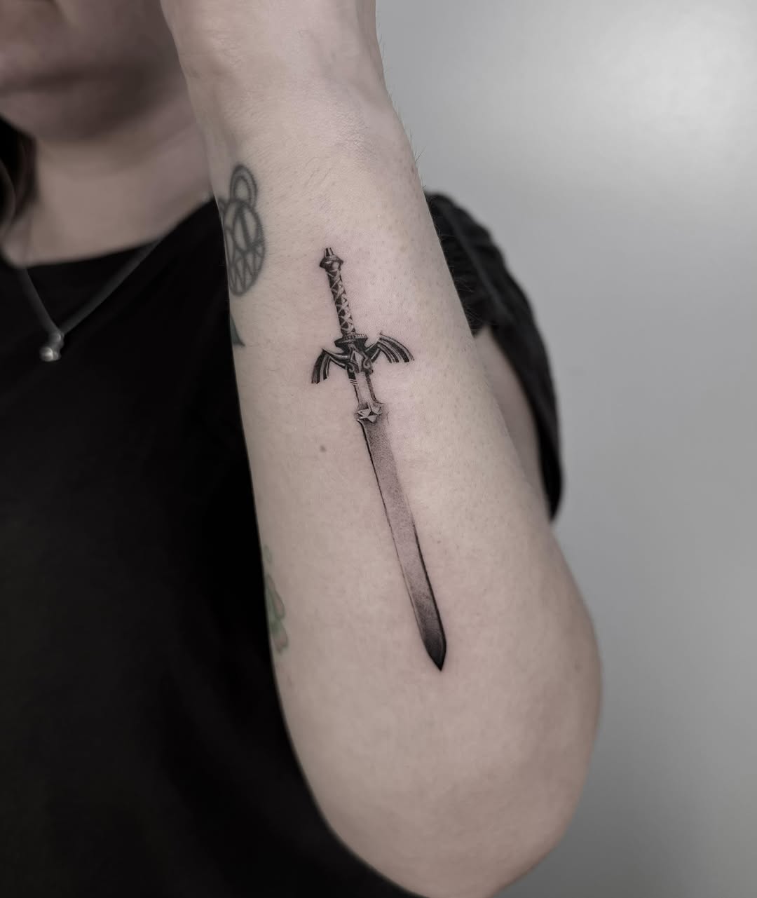 Sword black and grey tattoo on the forearm by ππππππ