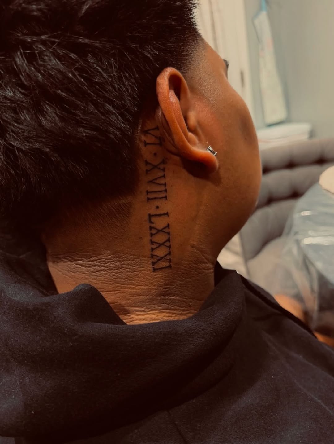 Roman numerals lettering tattoo on the neck by Alejandro N Duran