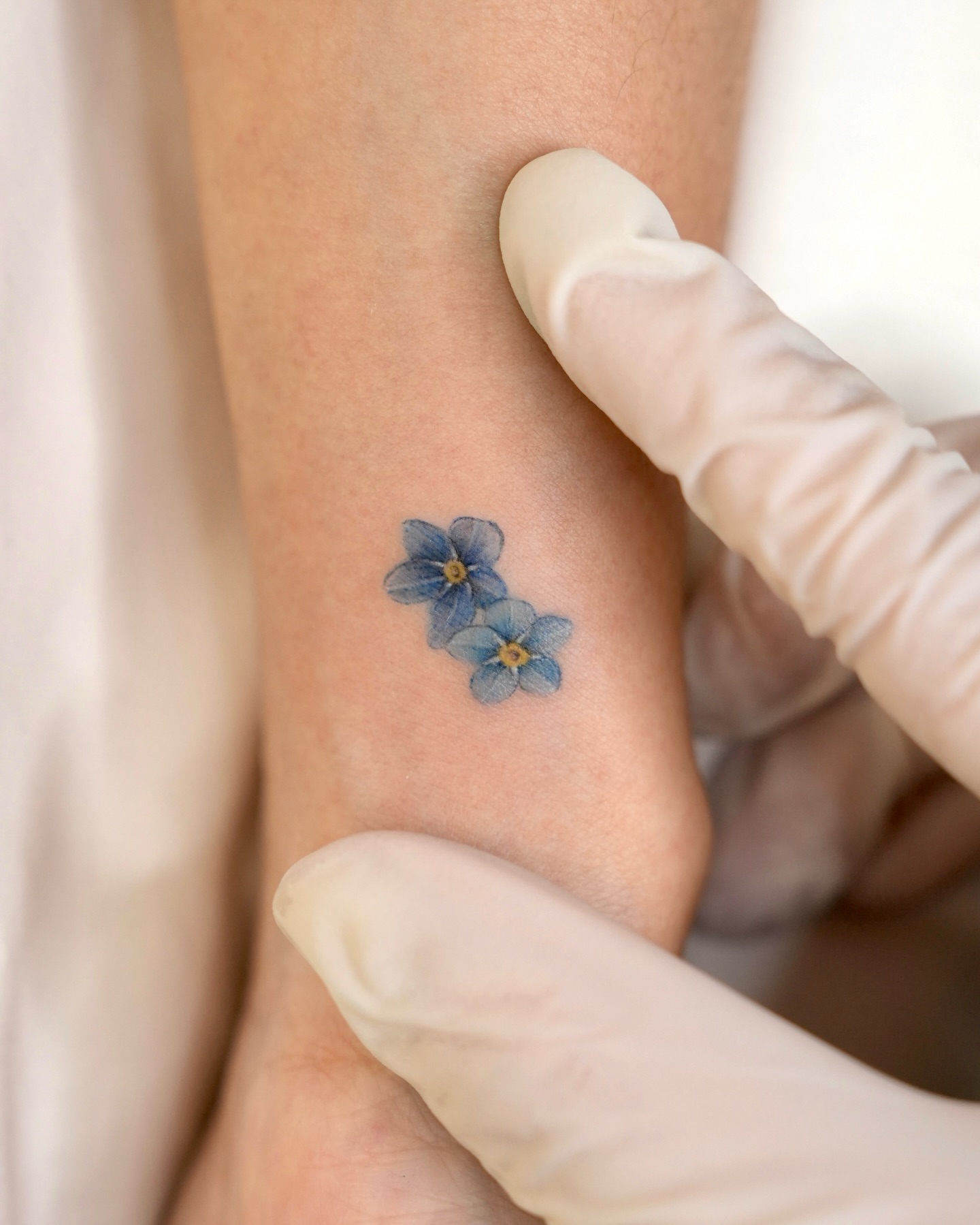 Forget-me-not flowers dotwork tattoo on the forearm by ⟡ 𝙶𝙰𝙾𝙽 ⟡ 제주타투 가온 Jejutattoo