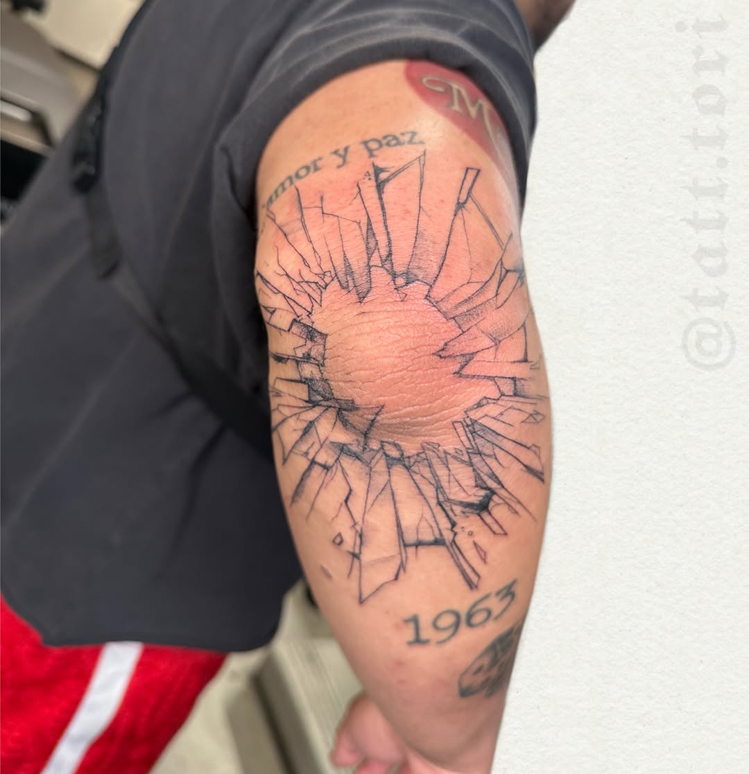 Broken glass geometric tattoo on the forearm by 𝔱𝔬𝔯𝔦