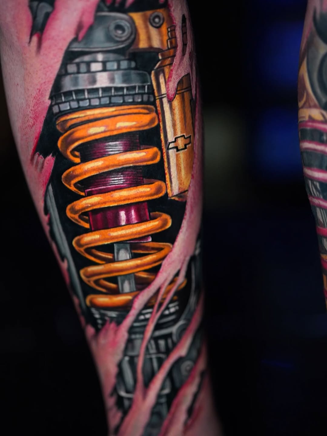 Mechanical shock absorber biomech tattoo on the forearm by Yasmani ramirez