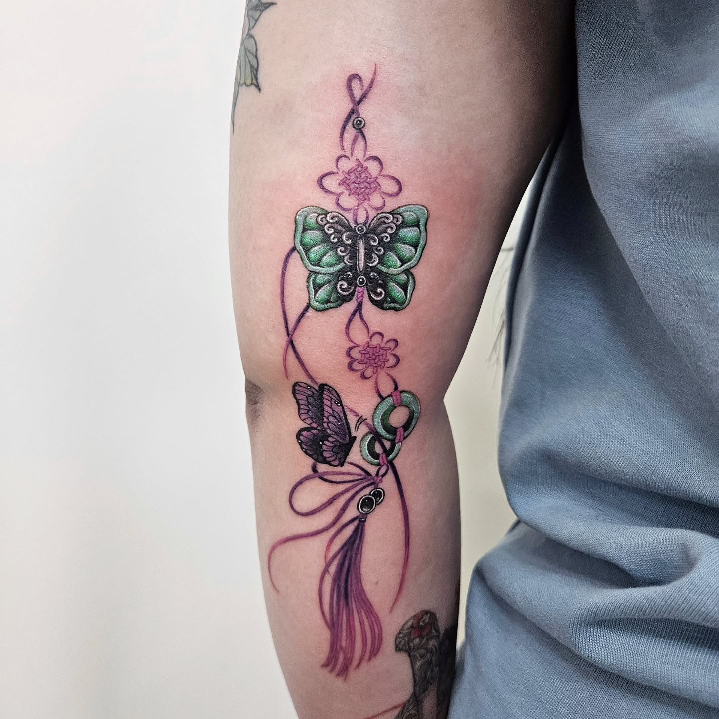 Butterfly and flowers new school tattoo on the forearm by Tattooer Hermin 허민