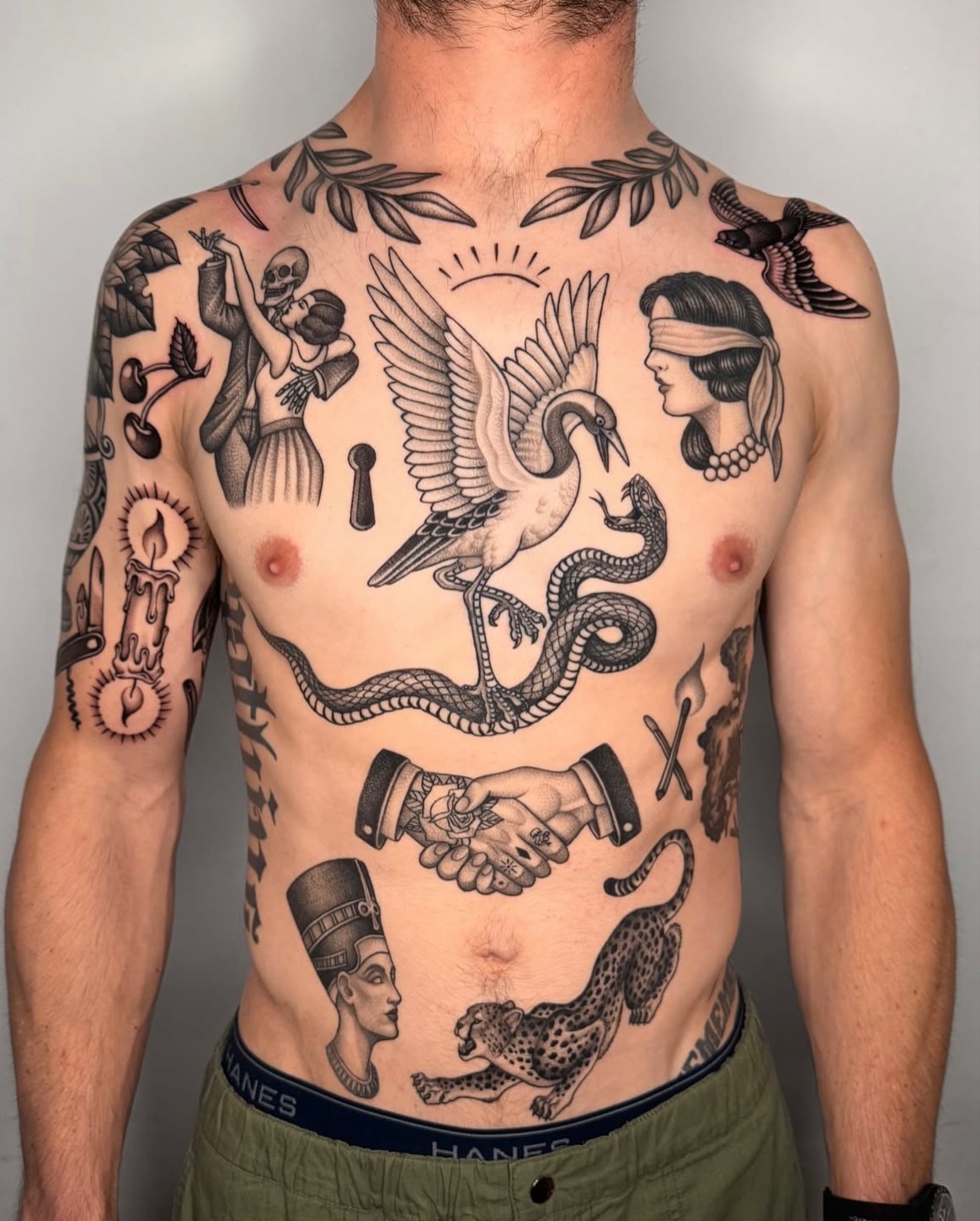 Mythological figures and symbols black and grey tattoo on the chest by Jae Traditional Tattoo