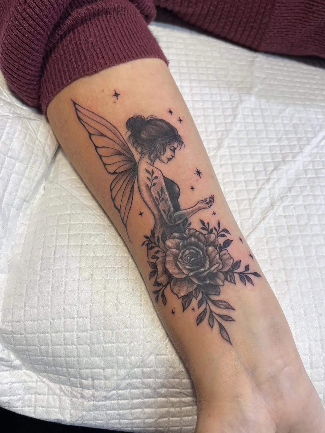 Fairy and rose fine line tattoo on the forearm by Art by Aimee