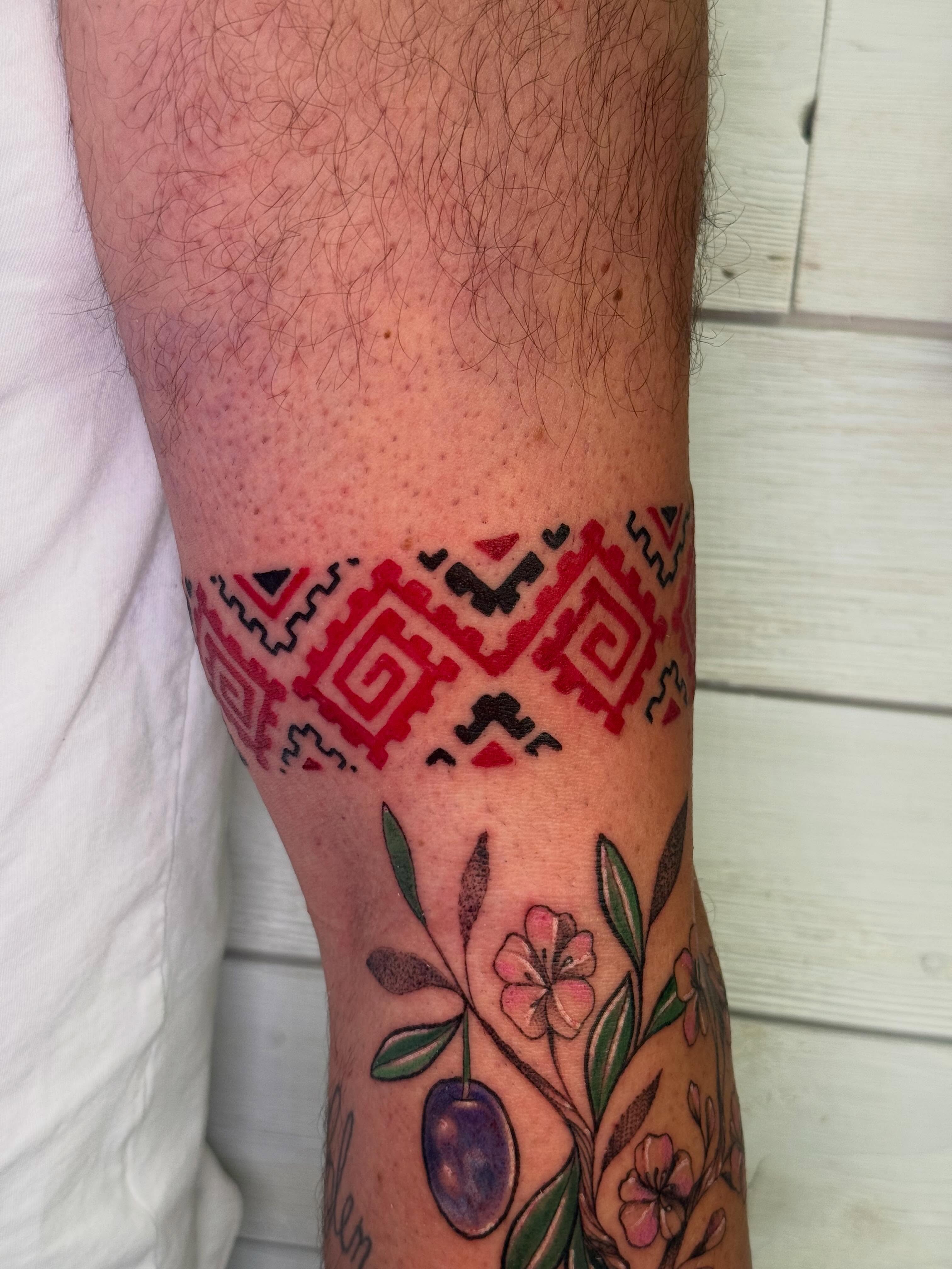 Geometric pattern with floral elements geometric tattoo on the calf by Diana Muresan