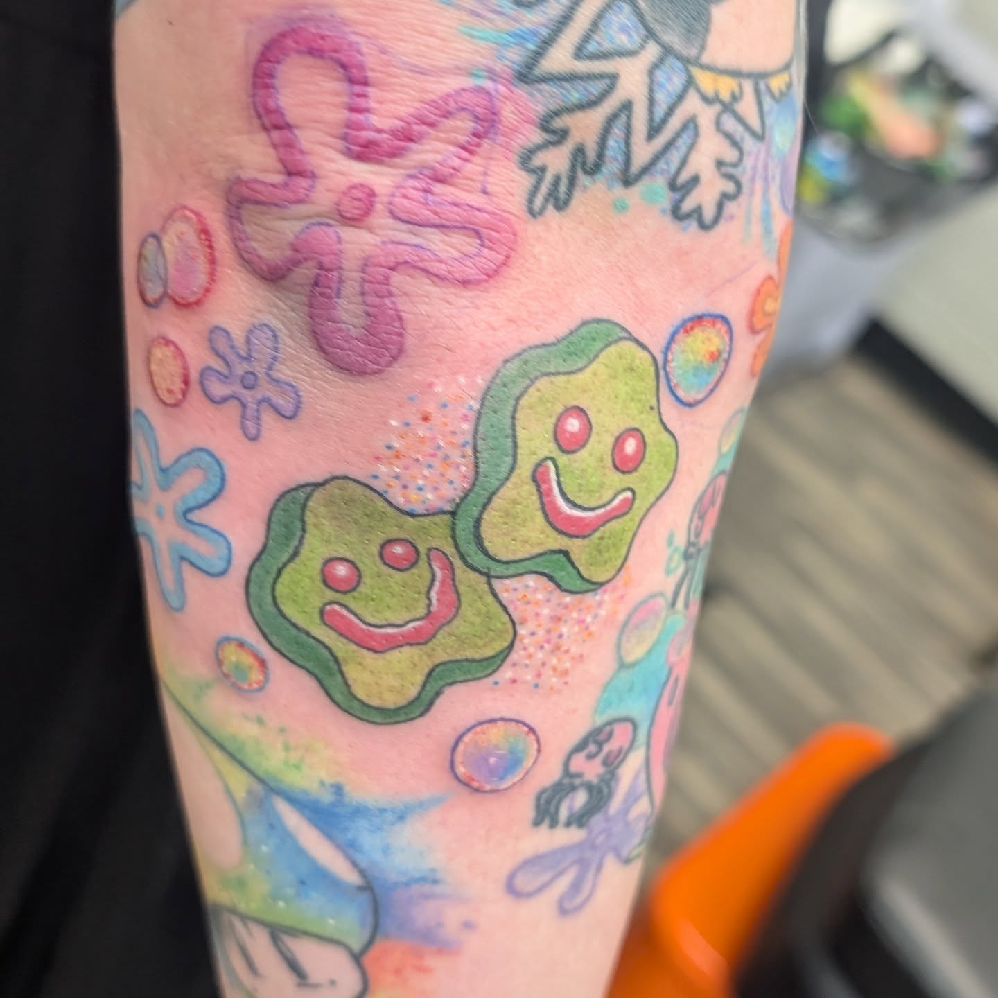 Smiling bacteria dotwork tattoo on the forearm by Talia Zula, Loveland, Ohio