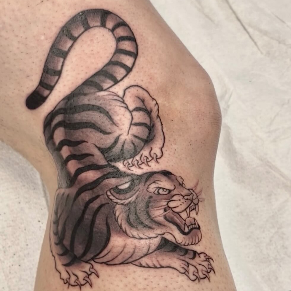 Tiger black and grey tattoo on the thigh by Brianna Jo Ballinghoff