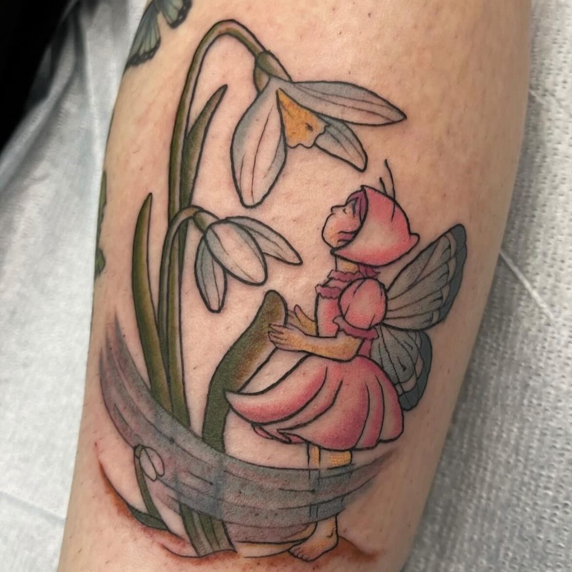 Fairy and snowdrops American traditional tattoo on the forearm by Brianna Jo Ballinghoff