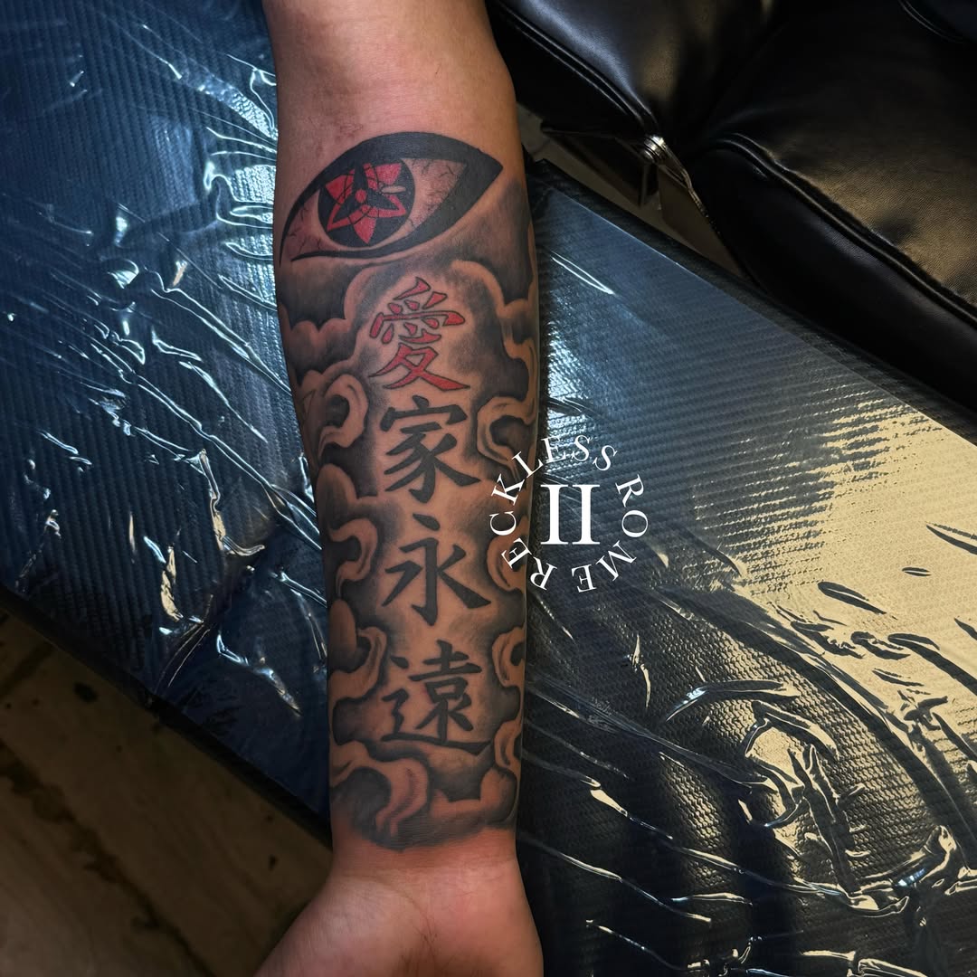 Eye and kanji black and grey tattoo on the forearm by Rome