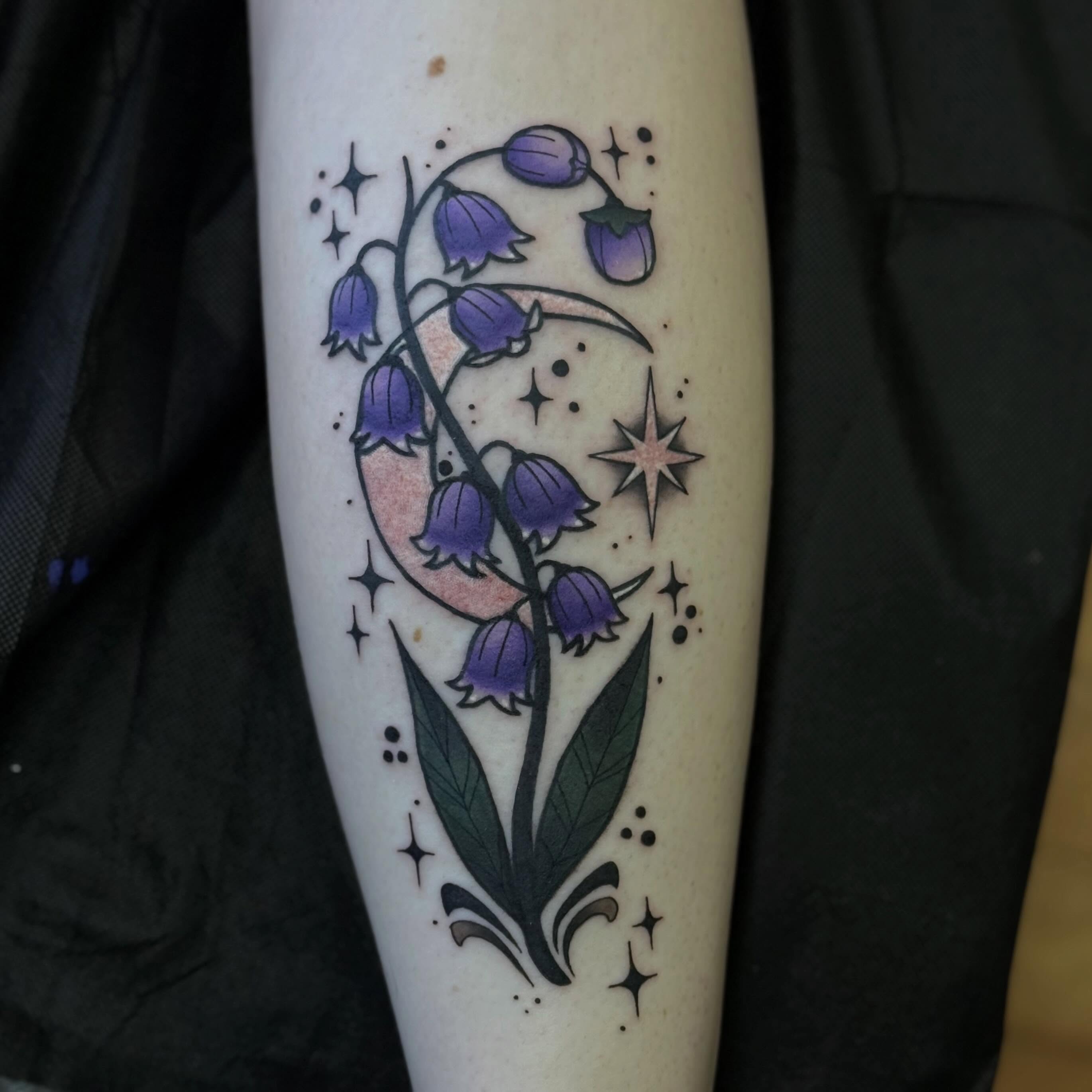 Bellflowers and moon dotwork tattoo on the forearm by Nic